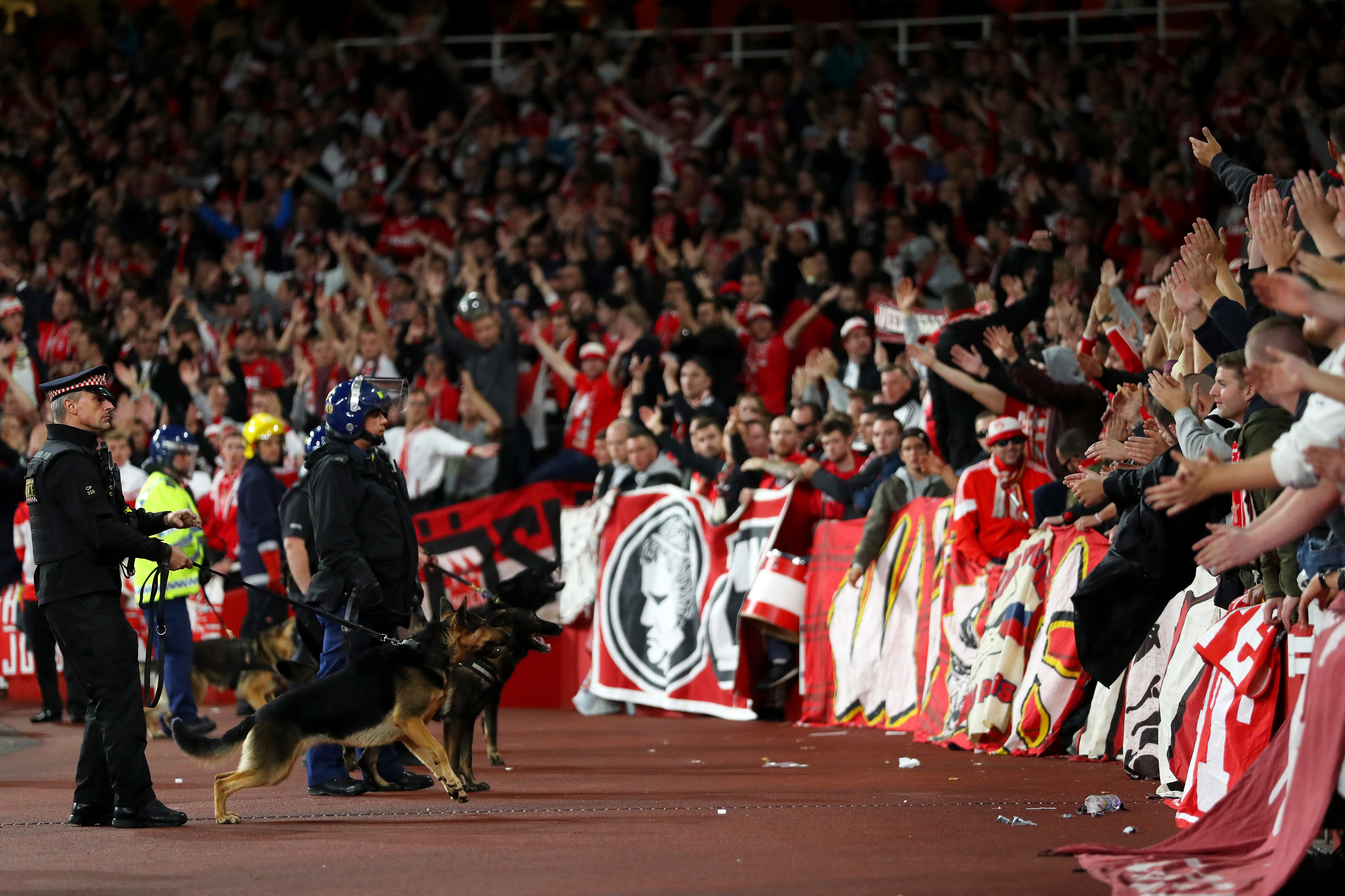 Riot police with dogs stand in front of fans ahead of the match (Richard Heathcote/Getty Images)
