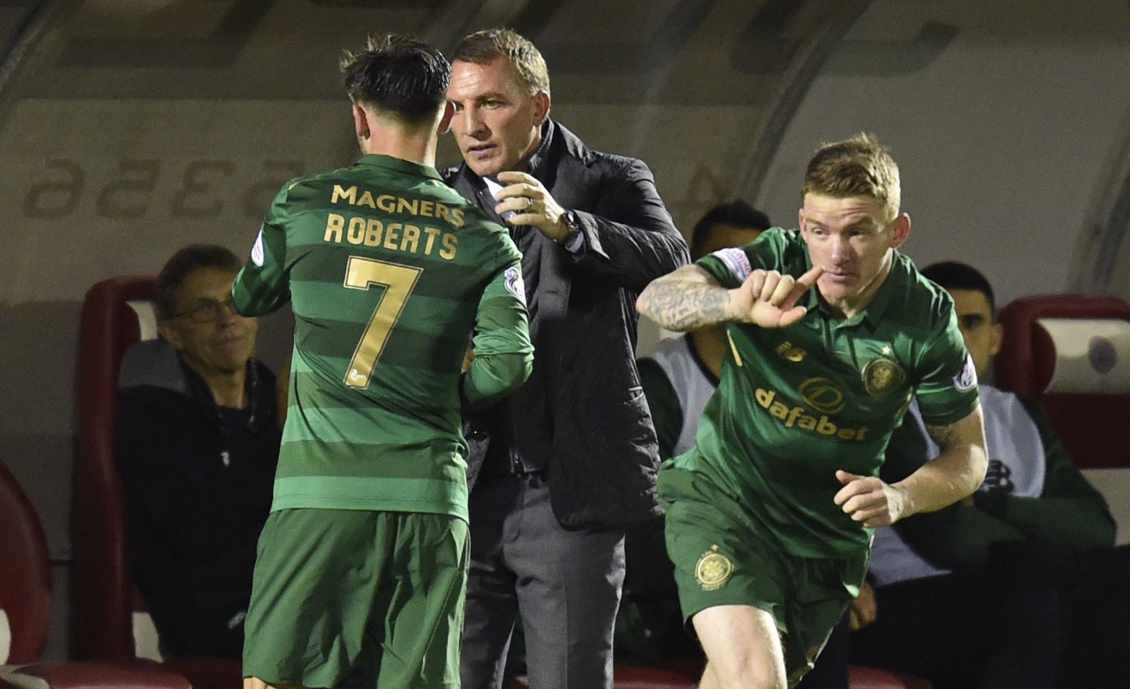 Celtic manager Brendan Rodgers (right) embraces Patrick Roberts as he is subbed (SNS Group / Rob Casey)