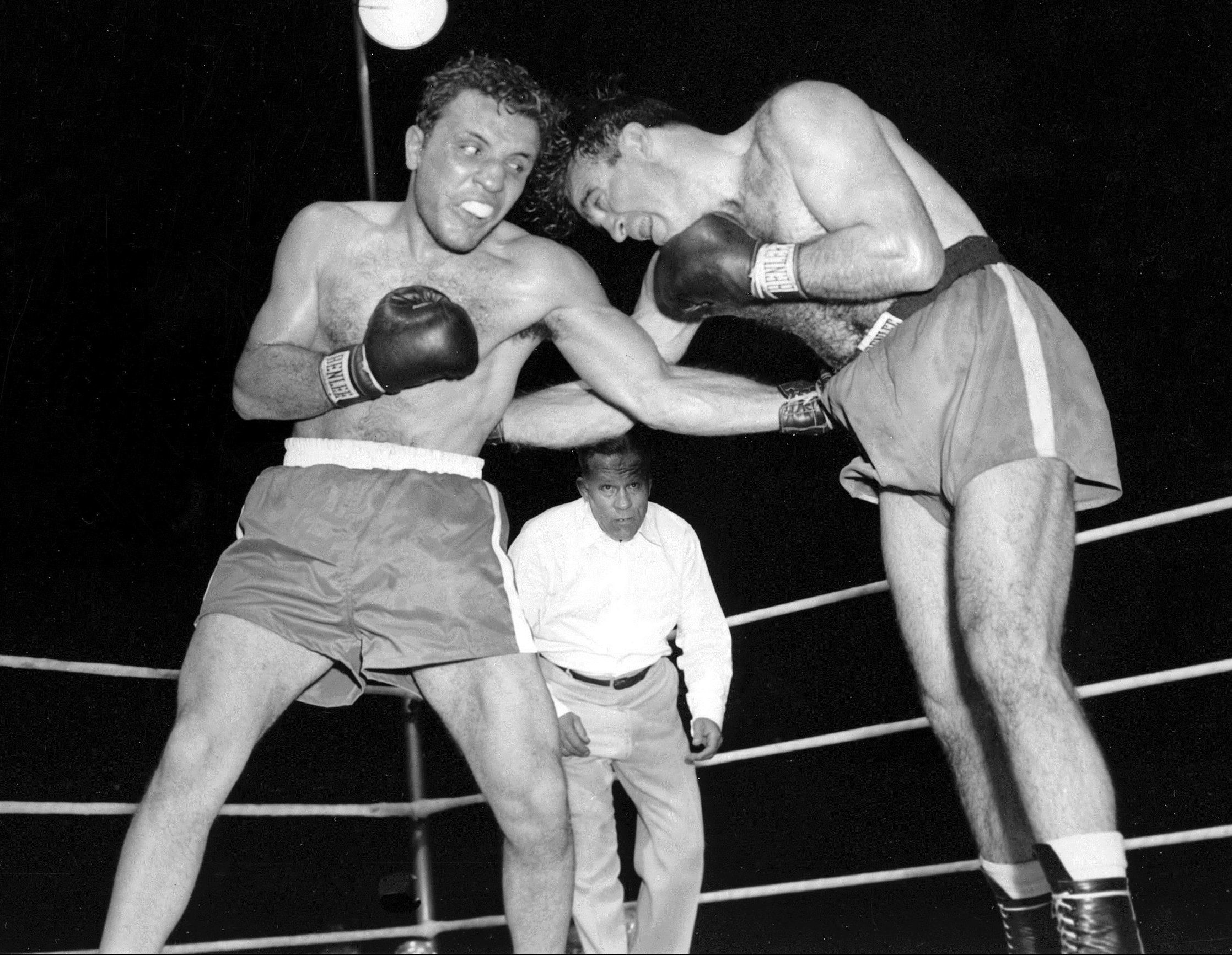 Jake LaMotta, left, pounds Marcel Cerdan in third round of a world middleweight title bout in 1949 (AP Photo/File)