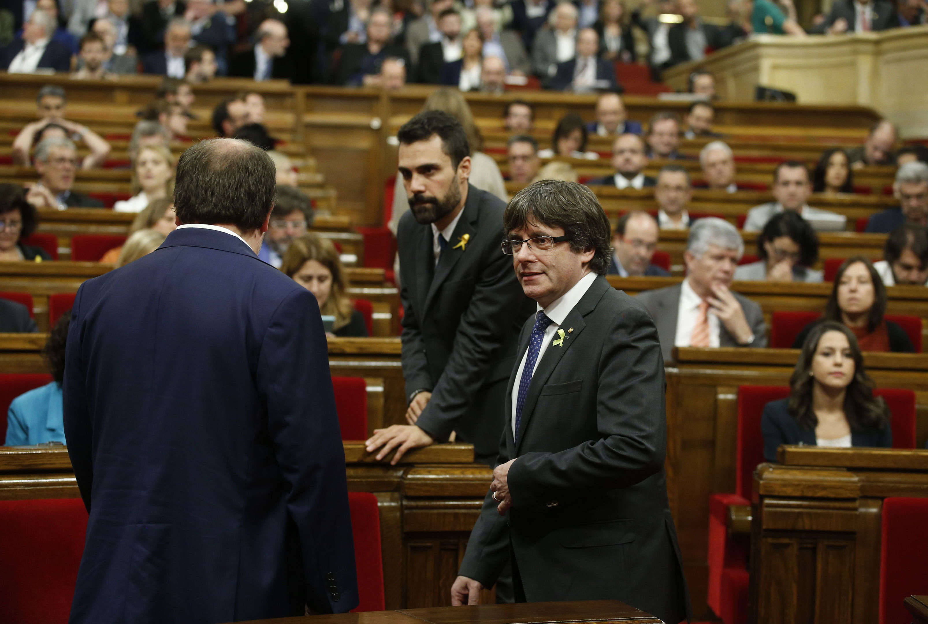 Catalan President Carles Puigdemont, right, during a session inside the Catalan parliament (AP Photo/Manu Fernandez)