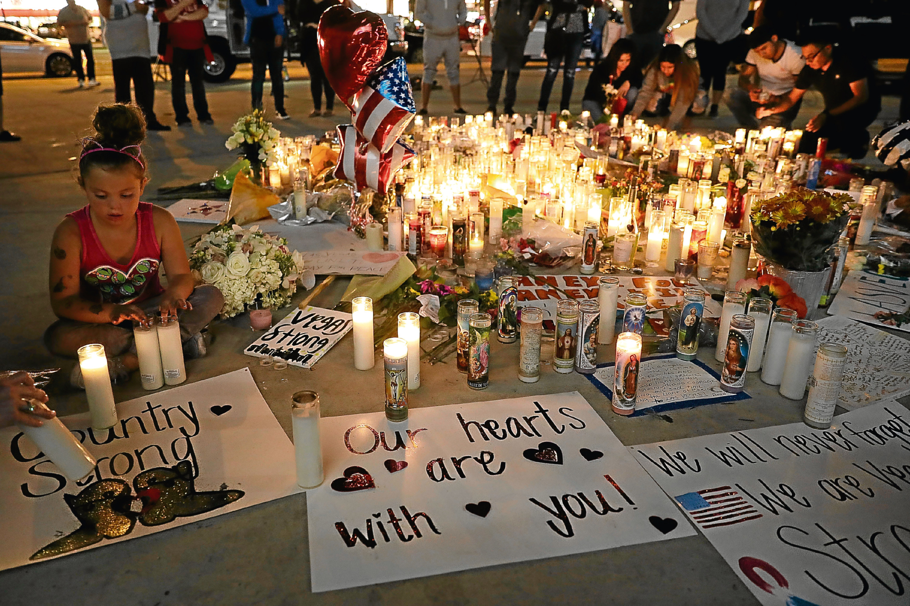 As the people rally round to support the victims of yet another senseless tragedy caused by guns,                    will the powers-that-be actually do anything to prevent more such massacres? (Drew Angerer/Getty Images)
