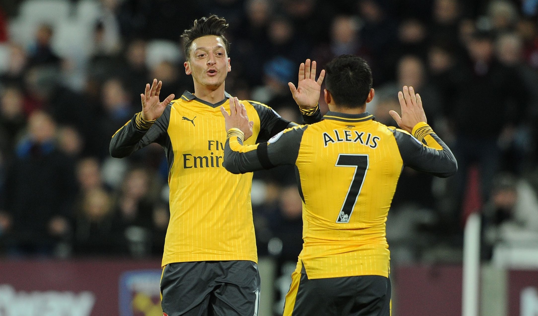 Mesut Ozil celebrates scoring  with Alexis Sanchez (David Price/Arsenal FC via Getty Images)