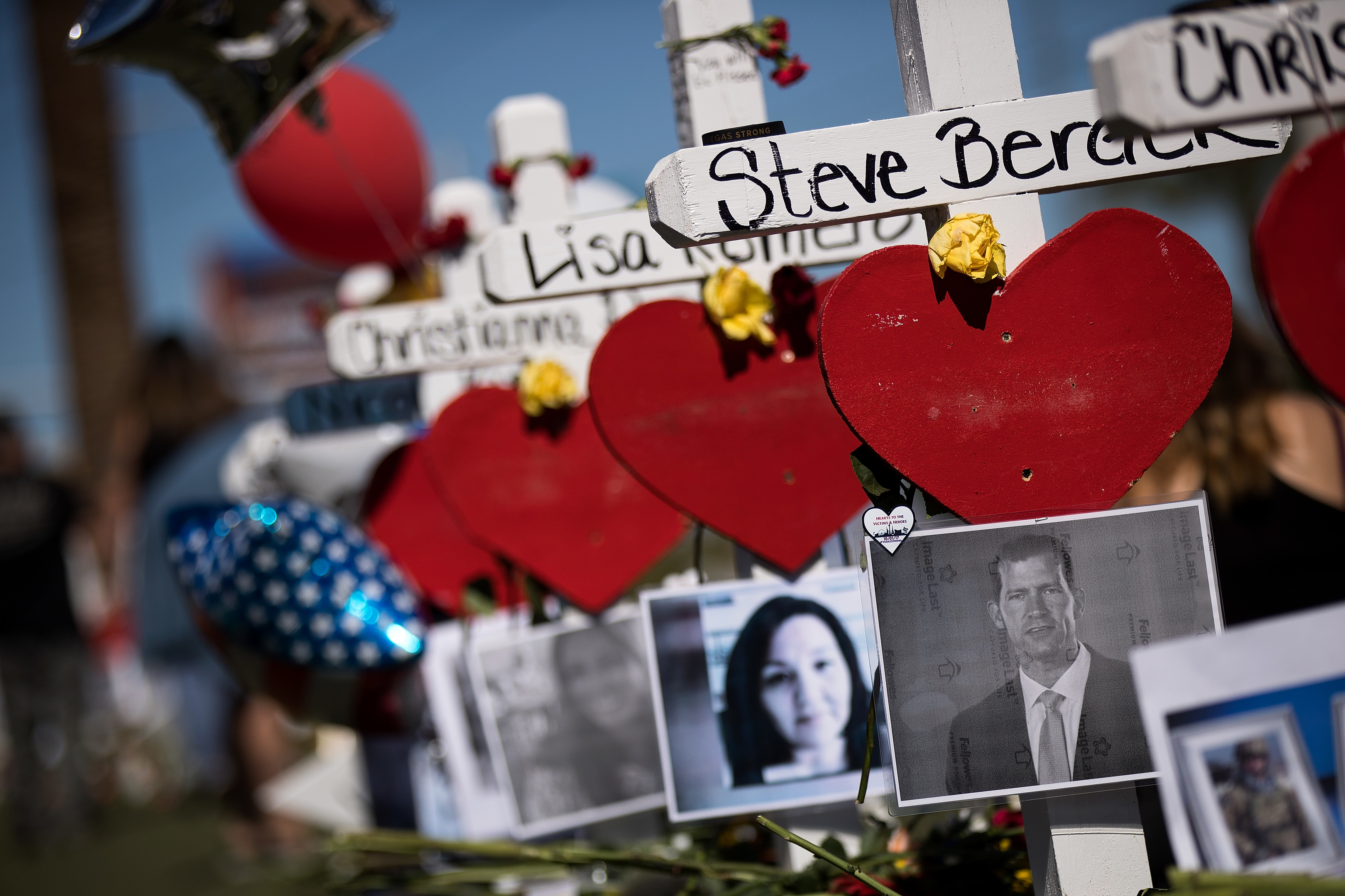 Photographs of the victims are included on some of the 58 white crosses for the victims of last Sunday night's mass shooting (Drew Angerer/Getty Images)