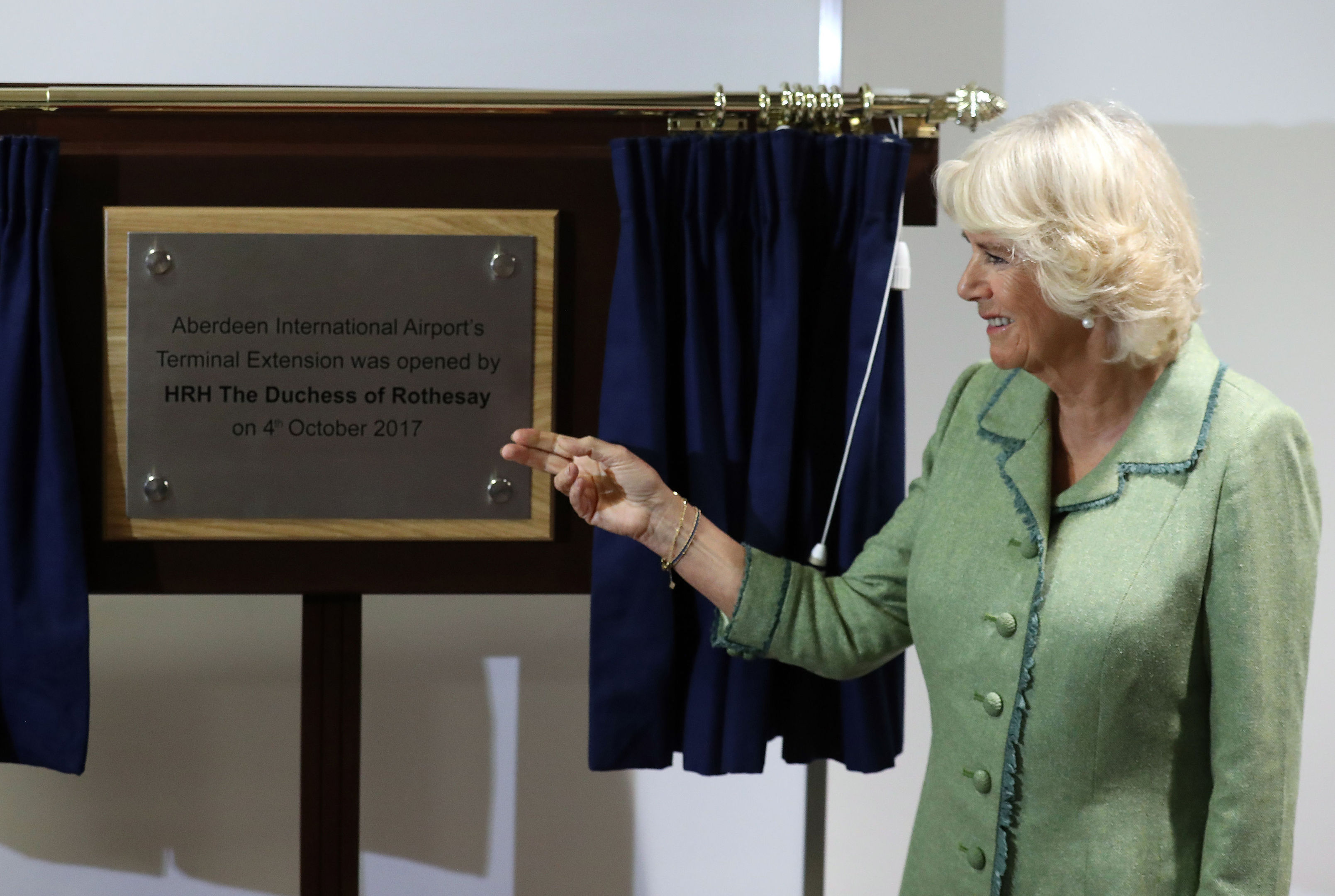 Duchess of Cornwall (known as the Duchess of Rothesay while in Scotland) unveils a plaque whilst opening a new extension to Aberdeen International Airport. (Andrew Milligan/PA Wire)