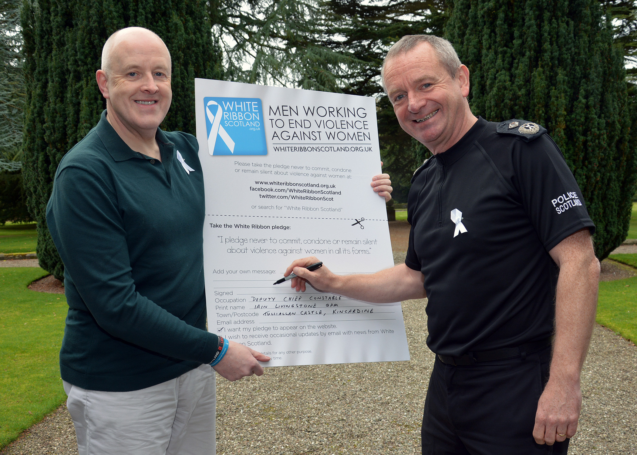 Deputy Chief Constable Iain Livingstone (right) giving his backing to the White Ribbon pledge (Police Scotland/PA Wire)