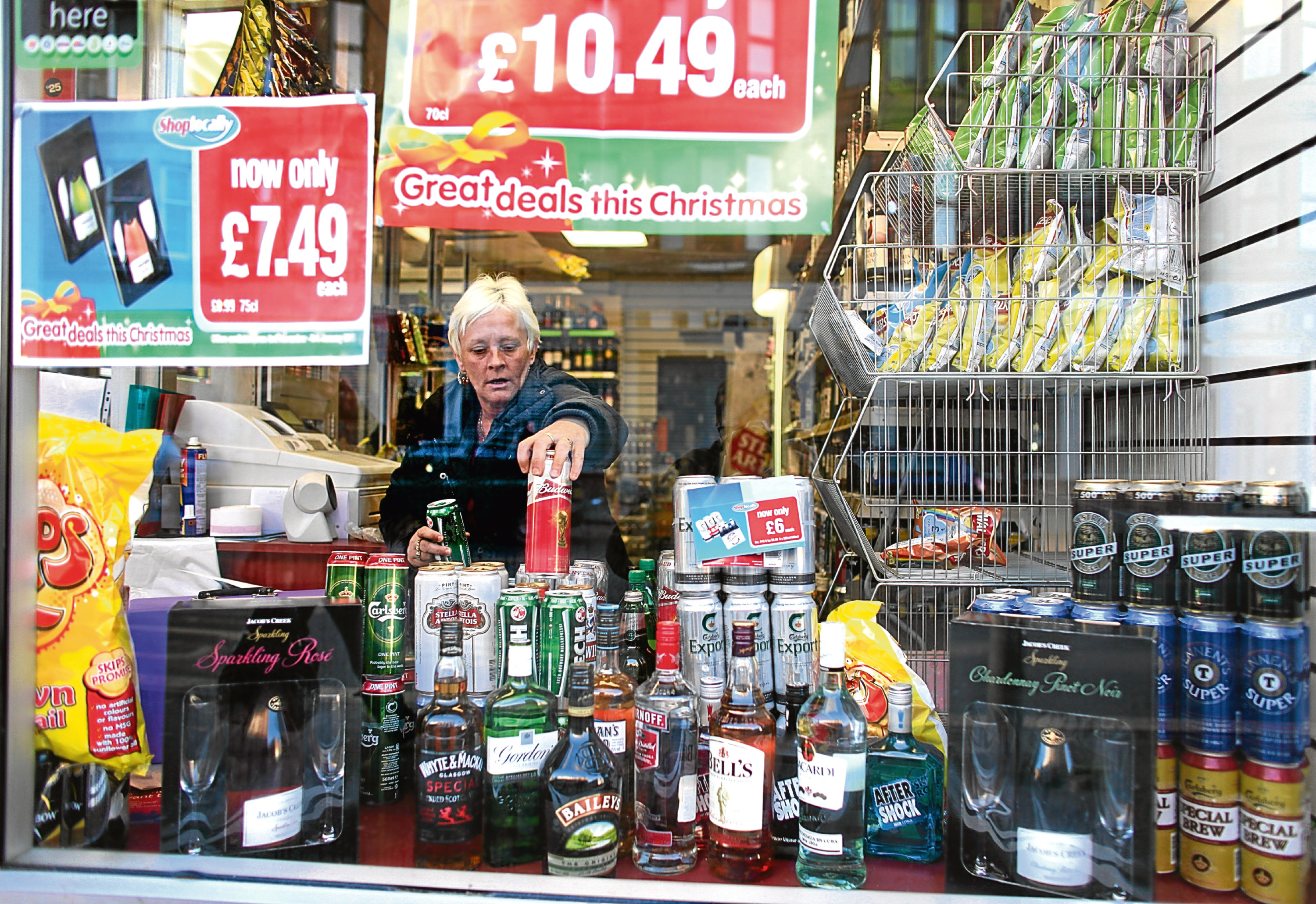 A woman in an off-licence in Govan, Glasgow (Getty Images)