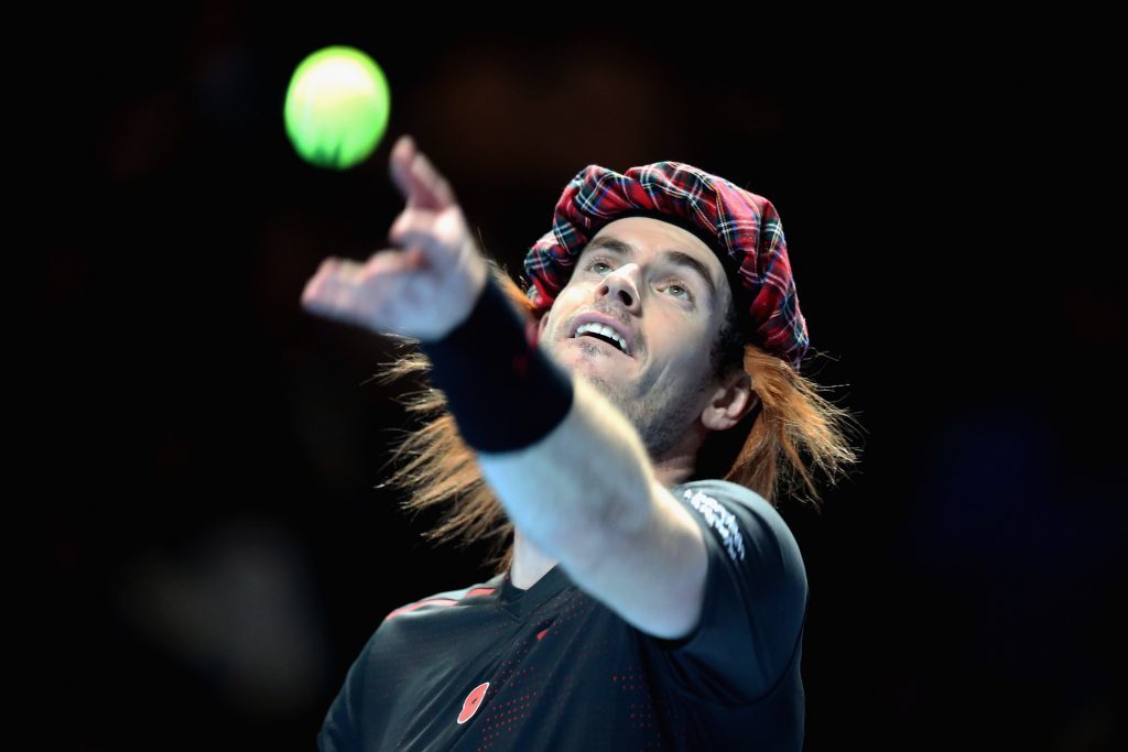Andy Murray wears a Hey Jimmy hat and serves during his match against Roger Federer during Andy Murray Live (Steve Welsh/Getty Images for Andy Murray Live)