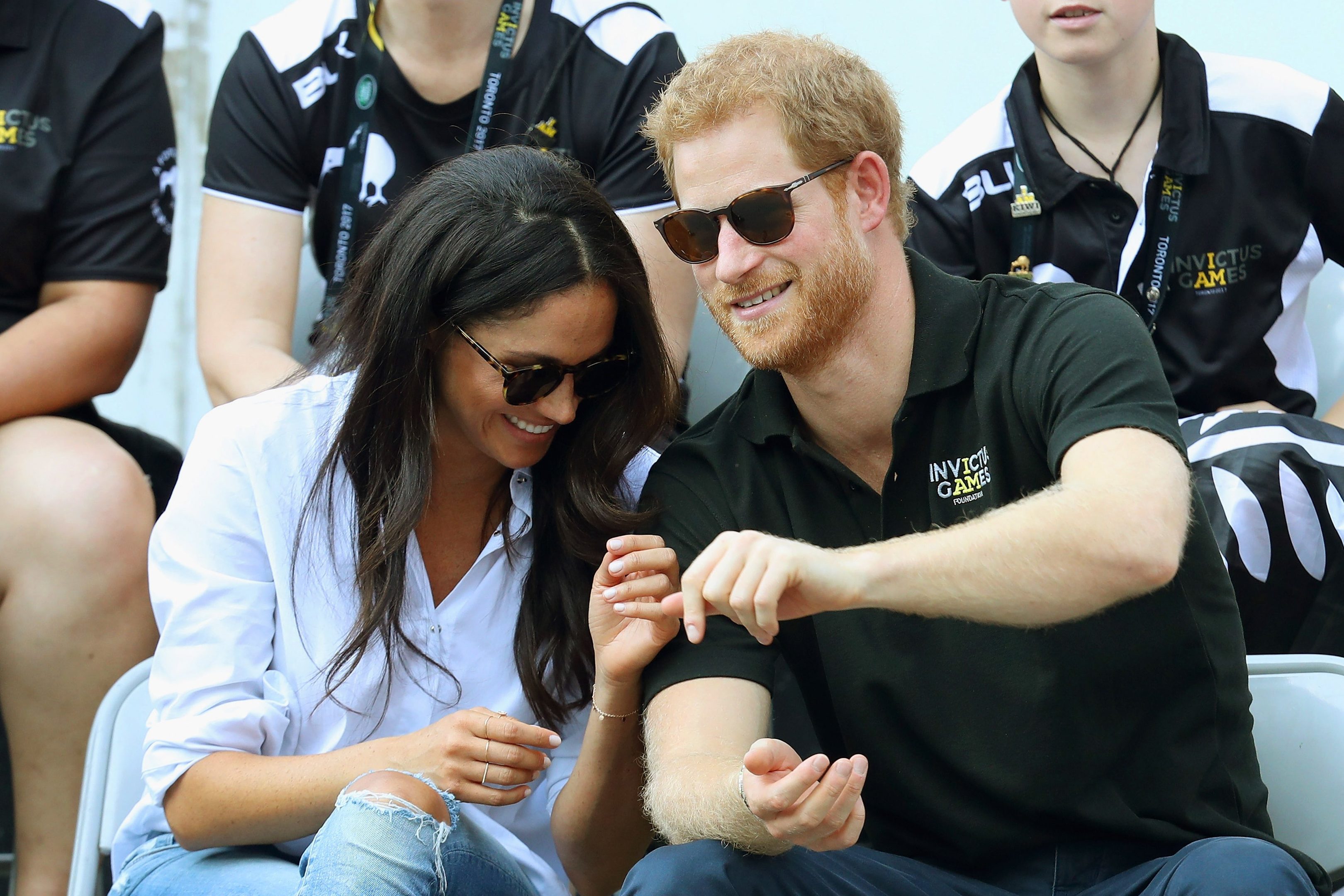 Prince Harry (R) and Meghan Markle (L) attend a Wheelchair Tennis match during the Invictus Games 2017 at Nathan Philips Square on September 25, 2017 in Toronto, Canada  (Photo by Chris Jackson/Getty Images for the Invictus Games Foundation )