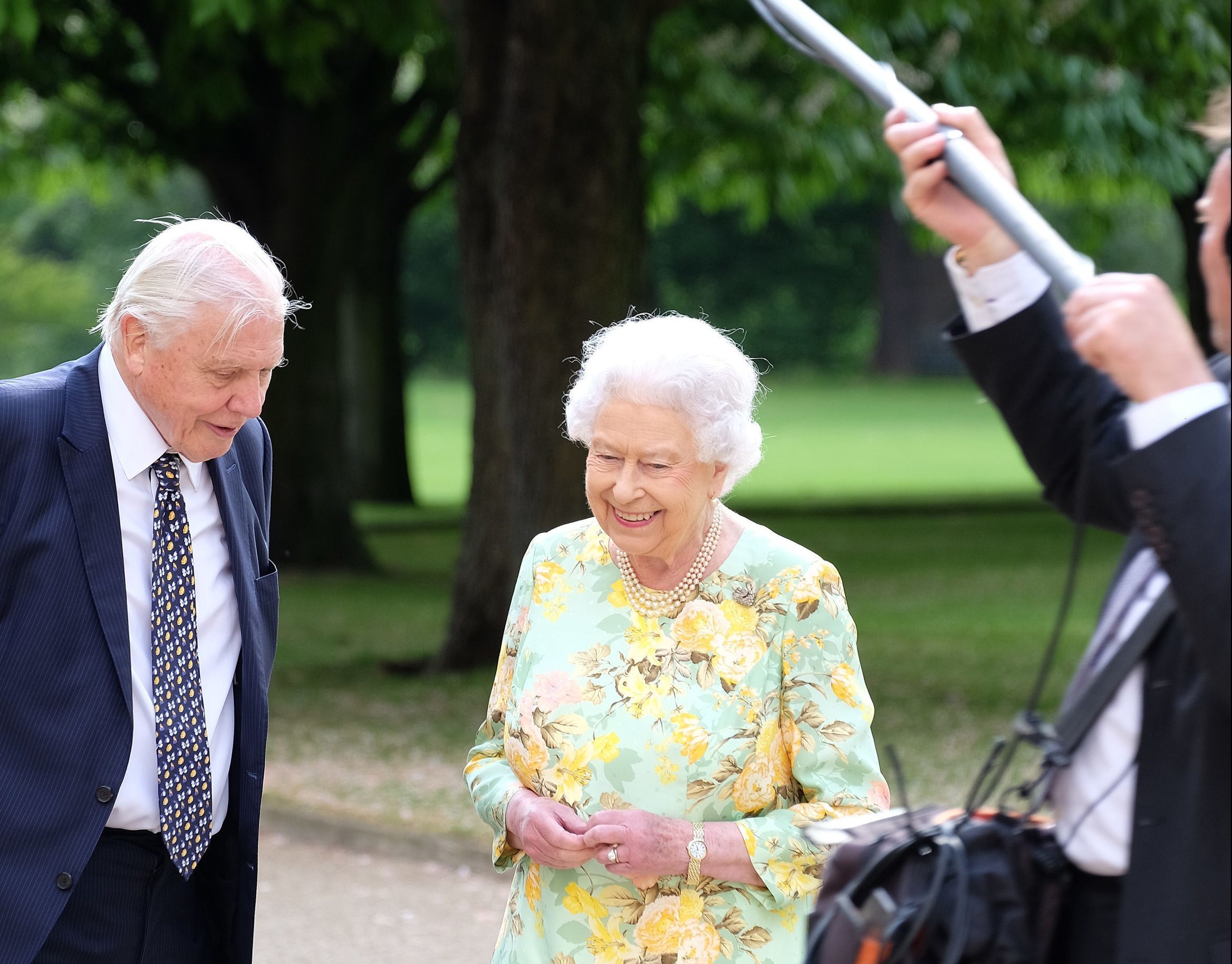Queen Elizabeth II and Sir David Attenborough in the gardens of Buckingham Palace during filming of a landmark documentary. (ITV/PA Wire)