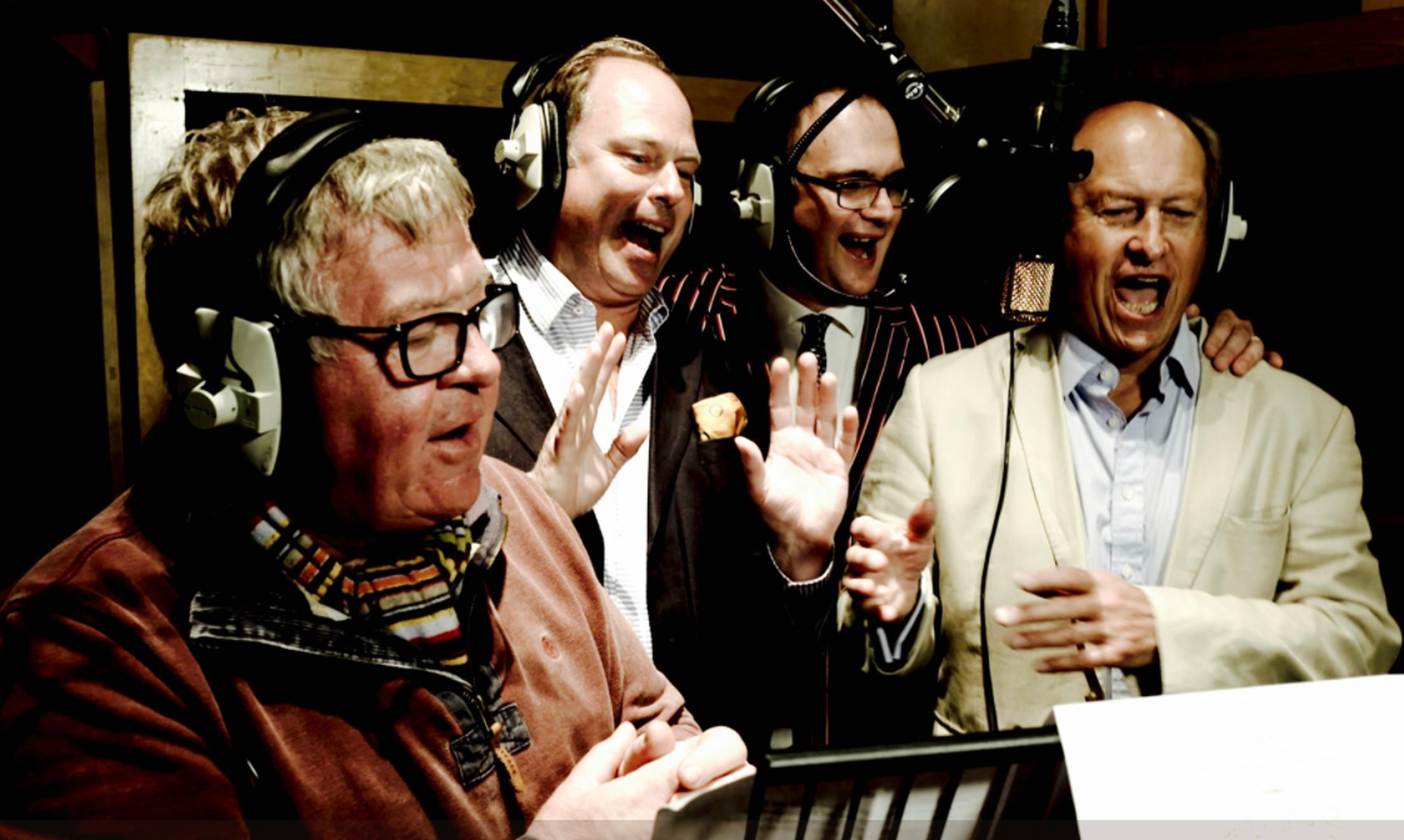 Television antiques experts Philip Serrell, James Braxton, Charles Hanson and Charlie Ross recording their charity Christmas single in a London recording studio. (Hansons Auctioneers/PA Wire)