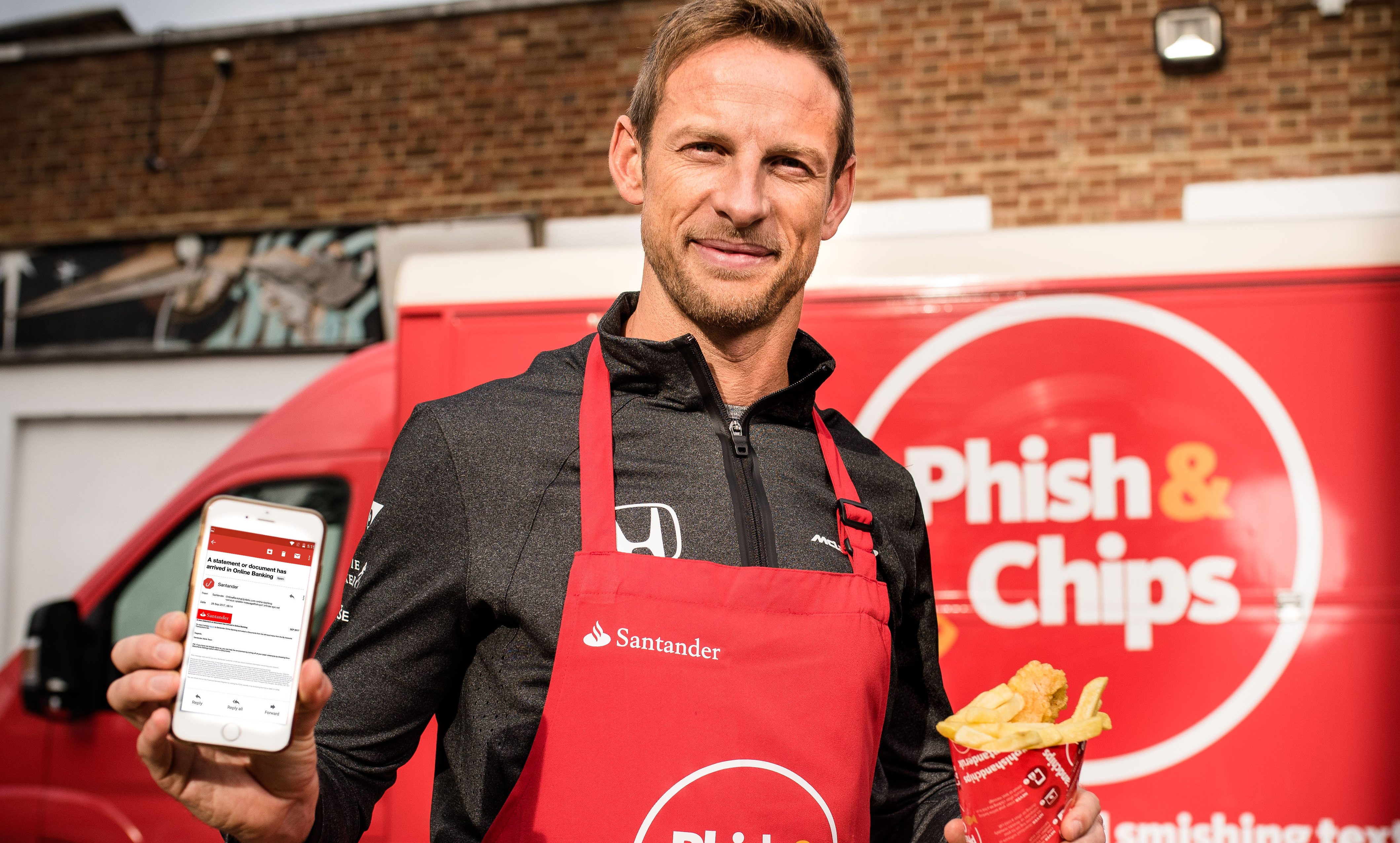 Jenson Button stands outside Santander’s Phish & Chip van where he has been serving fish and chips to the public in exchange for phishing emails and smishing texts (John Nguyen/Santander)