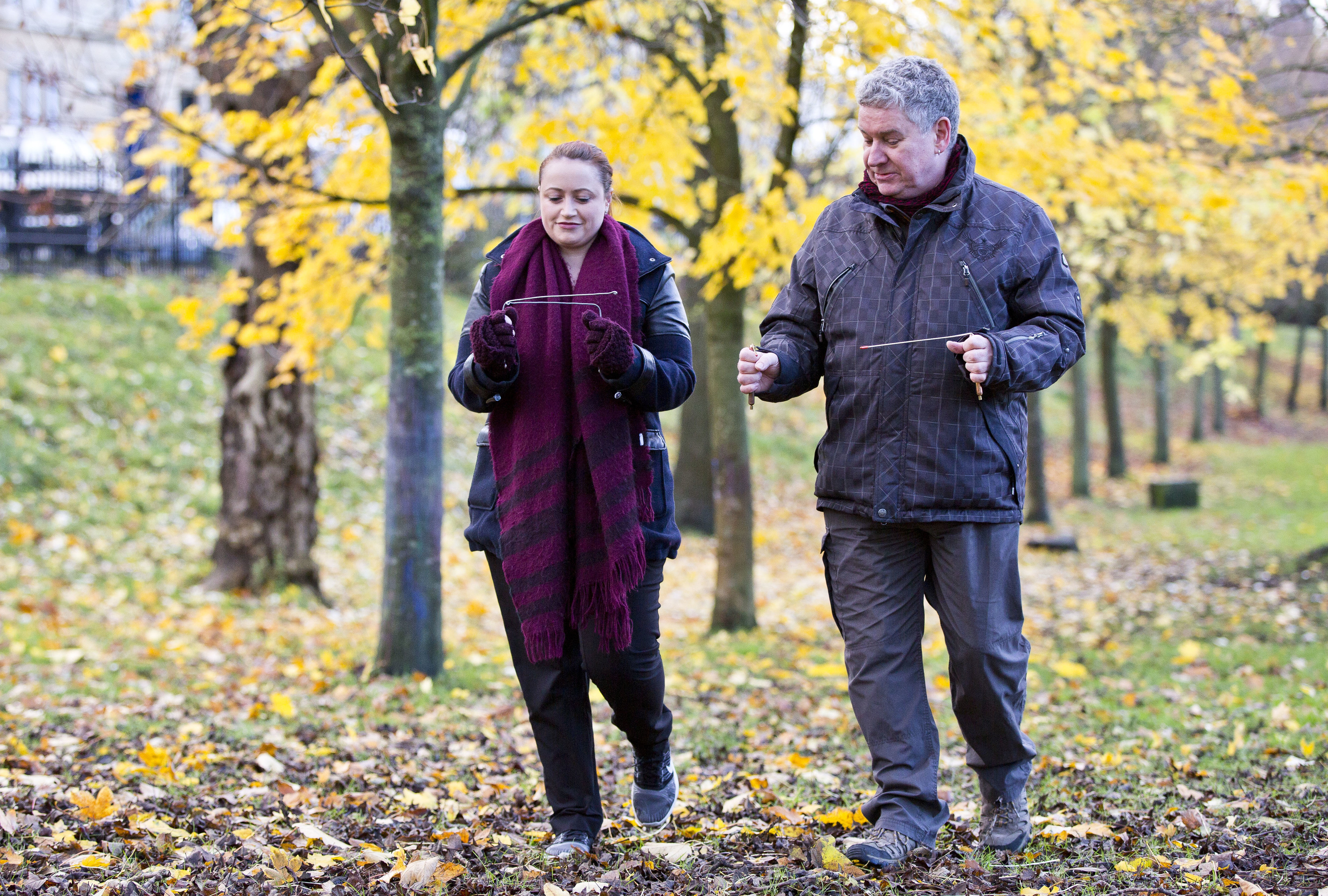 Sunday Post reporter Laura Smith tries her hand at the art of dowsing with Graeme Gardner in Kelvingrove Park (Jamie Williamson)