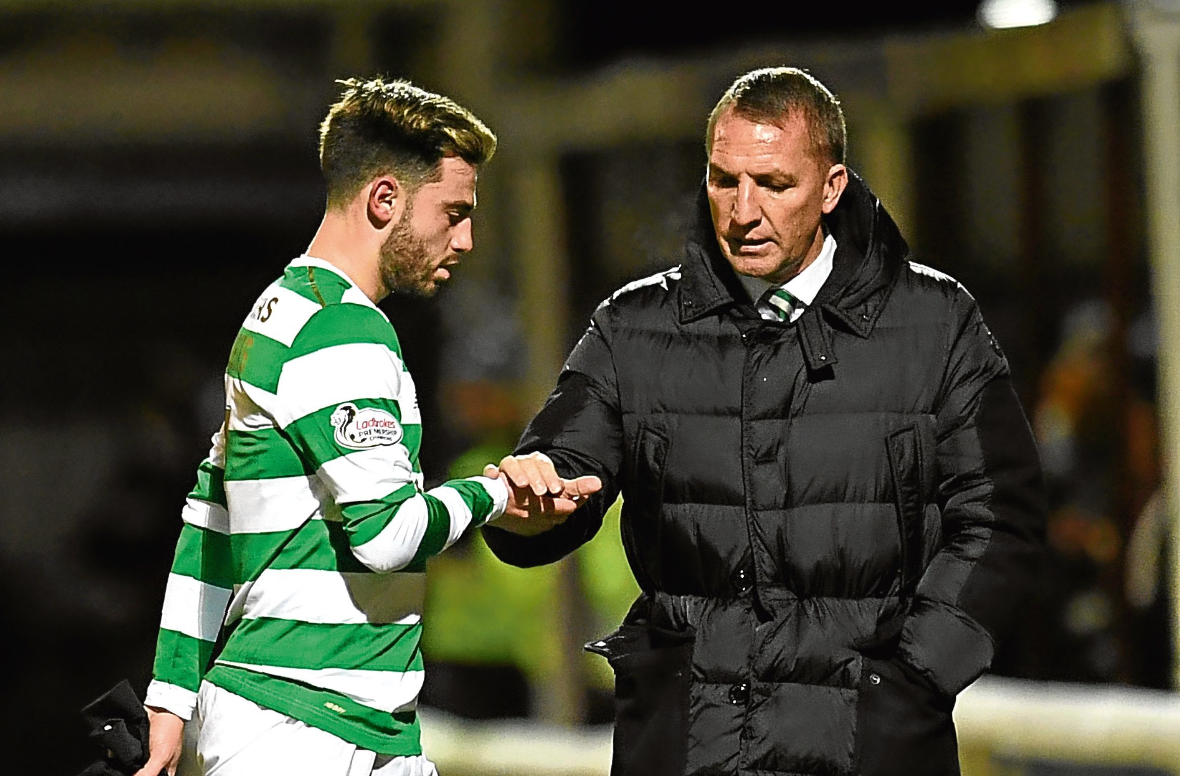 Celtic manager Brendan Rodgers consoles Patrick Roberts as he suffers an injury (SNS)