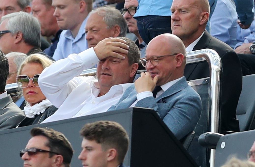Mike Ashley (left) and Lee Charnley in the stands during A Premier League (PA)