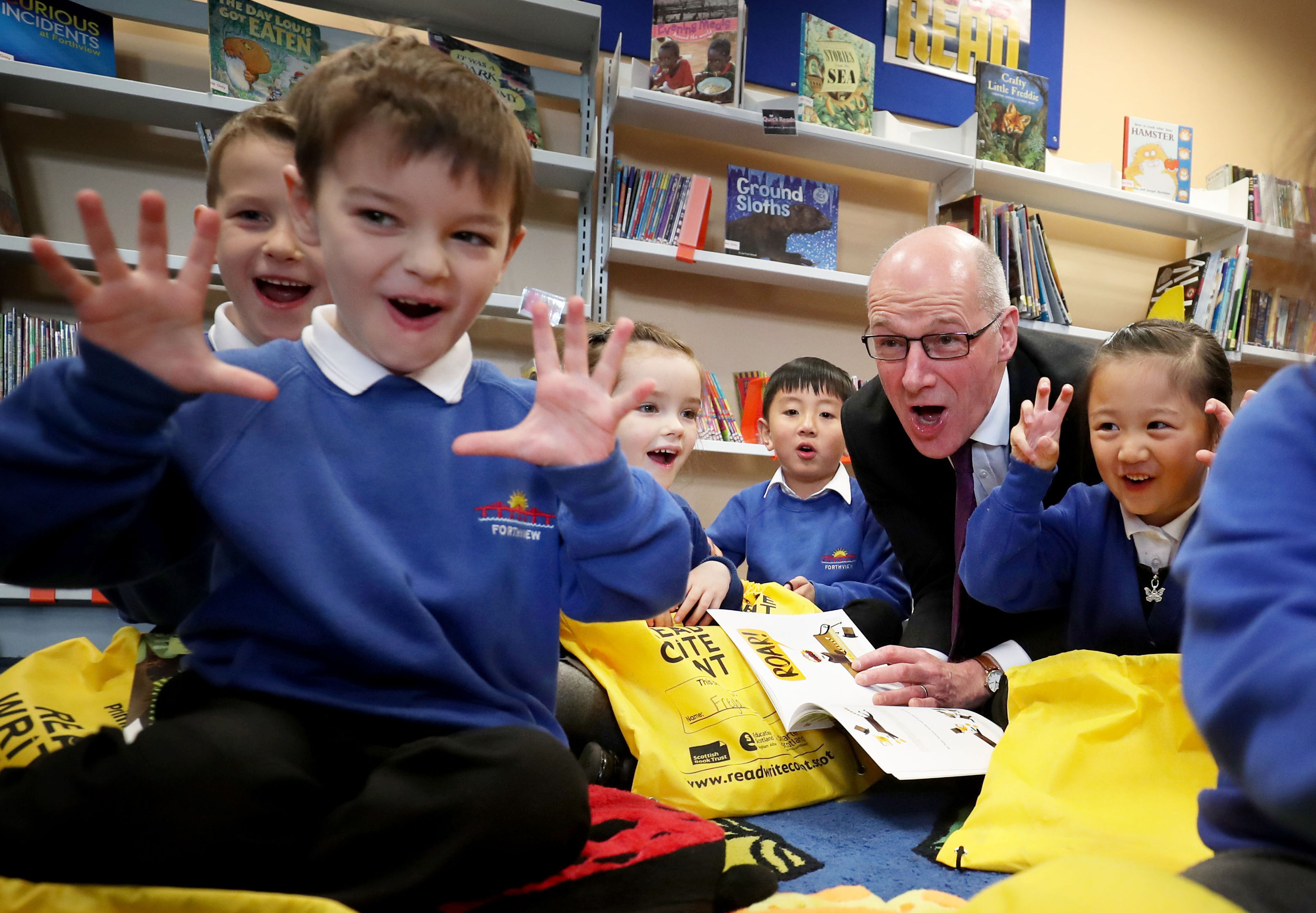John Swinney, pictured on a visit to an Edinburgh primary school, is under pressure on class sizes (Jane Barlow/PA Wire)