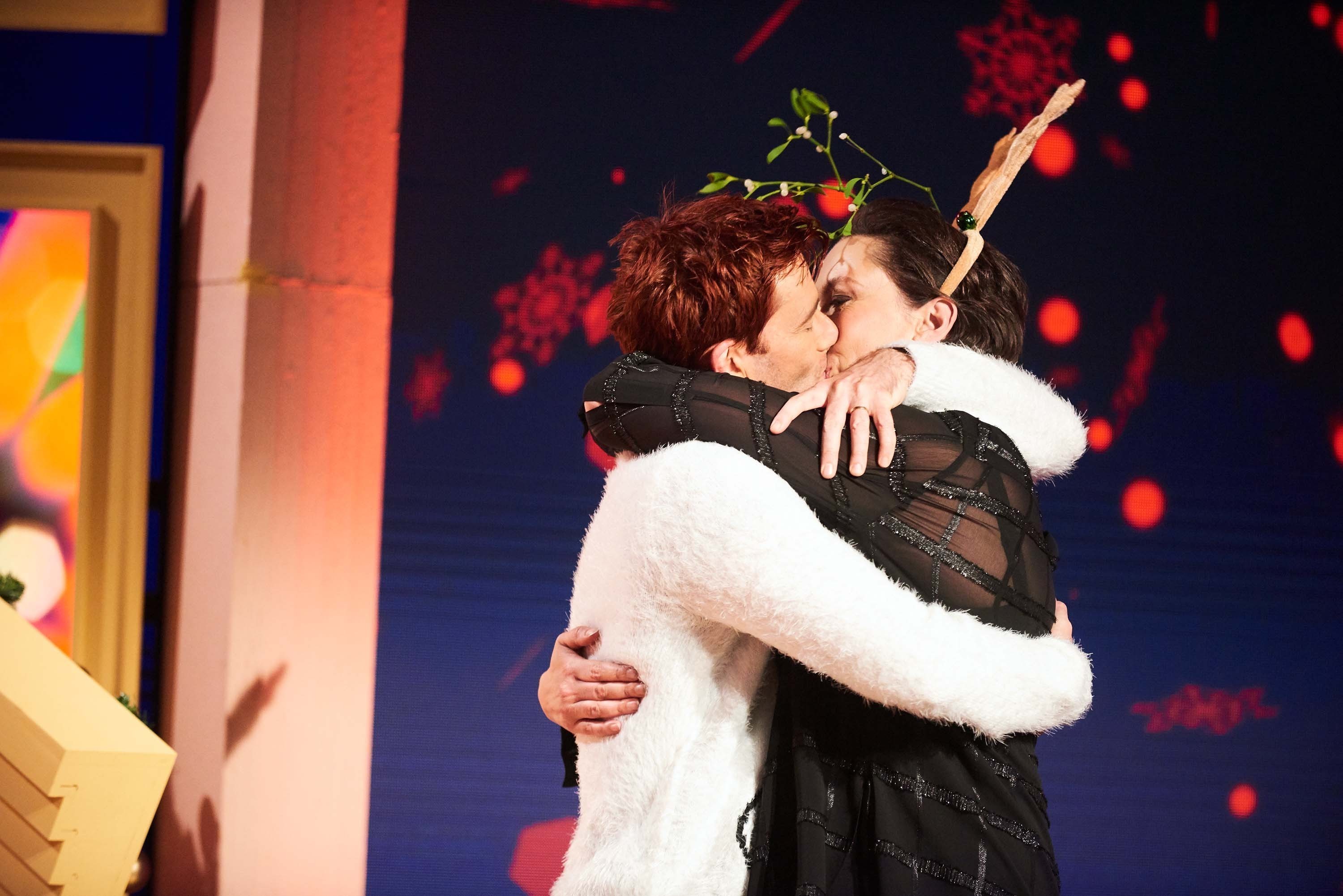 David Tennant kissing Miranda Hart as she presents her Christmas programme Miranda Does Christmas. (Ray Burmiston/Channel 4/PA Wire)