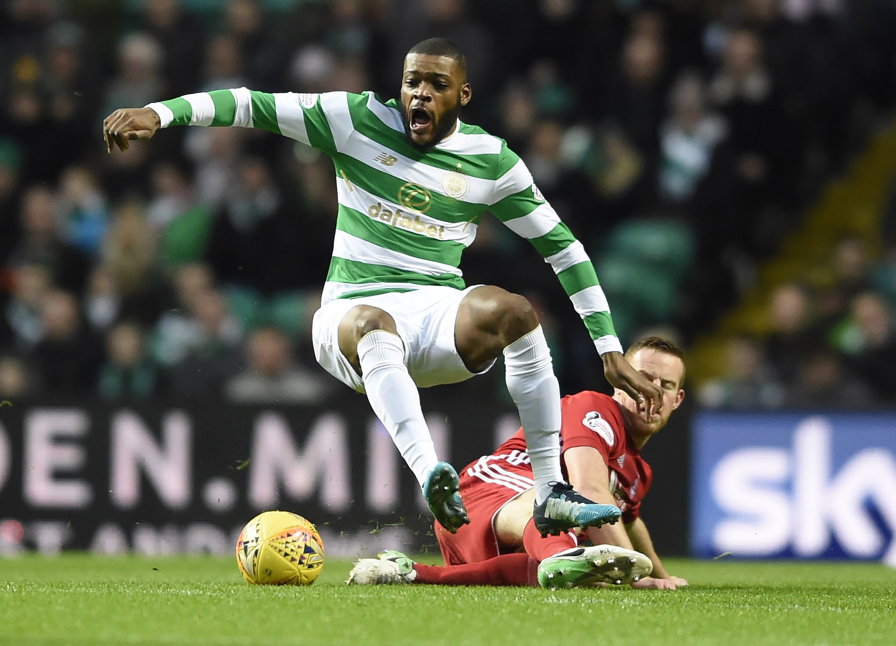 CelticÕs Olivier Ntcham (left) is brought down by AberdeenÕs Adam Rooney during the Scottish Premiership match at Celtic Park, Glasgow. (Ian Rutherford/PA Wire)