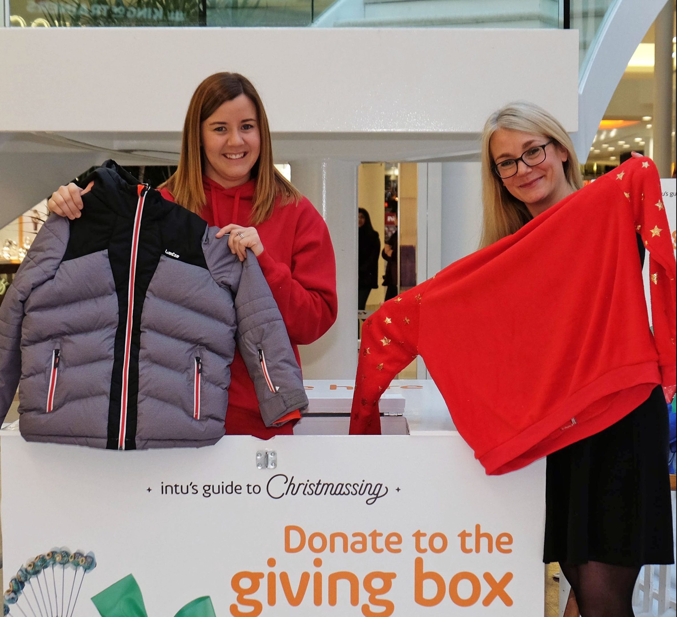 Lynne Gilday of the Back to School Bank Paisley charity and Lydia Brown, from intu Braehead.