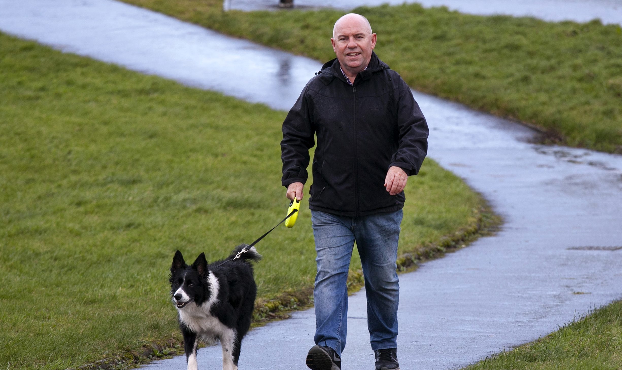 David Halcrow out walking his dog 3 weeks after a partial knee replacement (Alistair Linford)