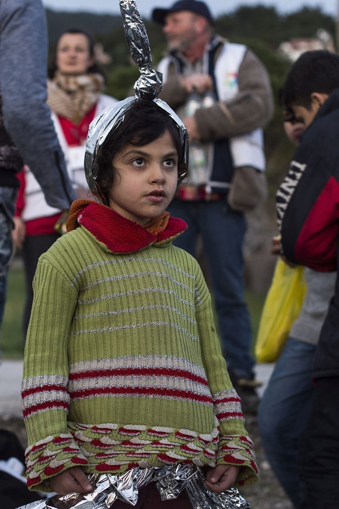 A girl from Afghanistan shortly after arriving on an inflatable boat with other refugees crossing the sea from Turkey to Lesbos,(Alexander Koerner/Getty Images)