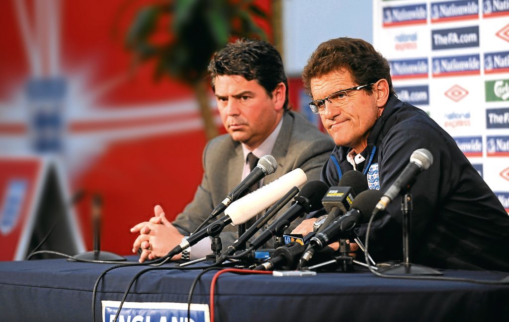 Fabio Capello speaks to the media at the England Press Conference with Managing Director of Club England, Adrian Bevington (Michael Regan/Getty Images)