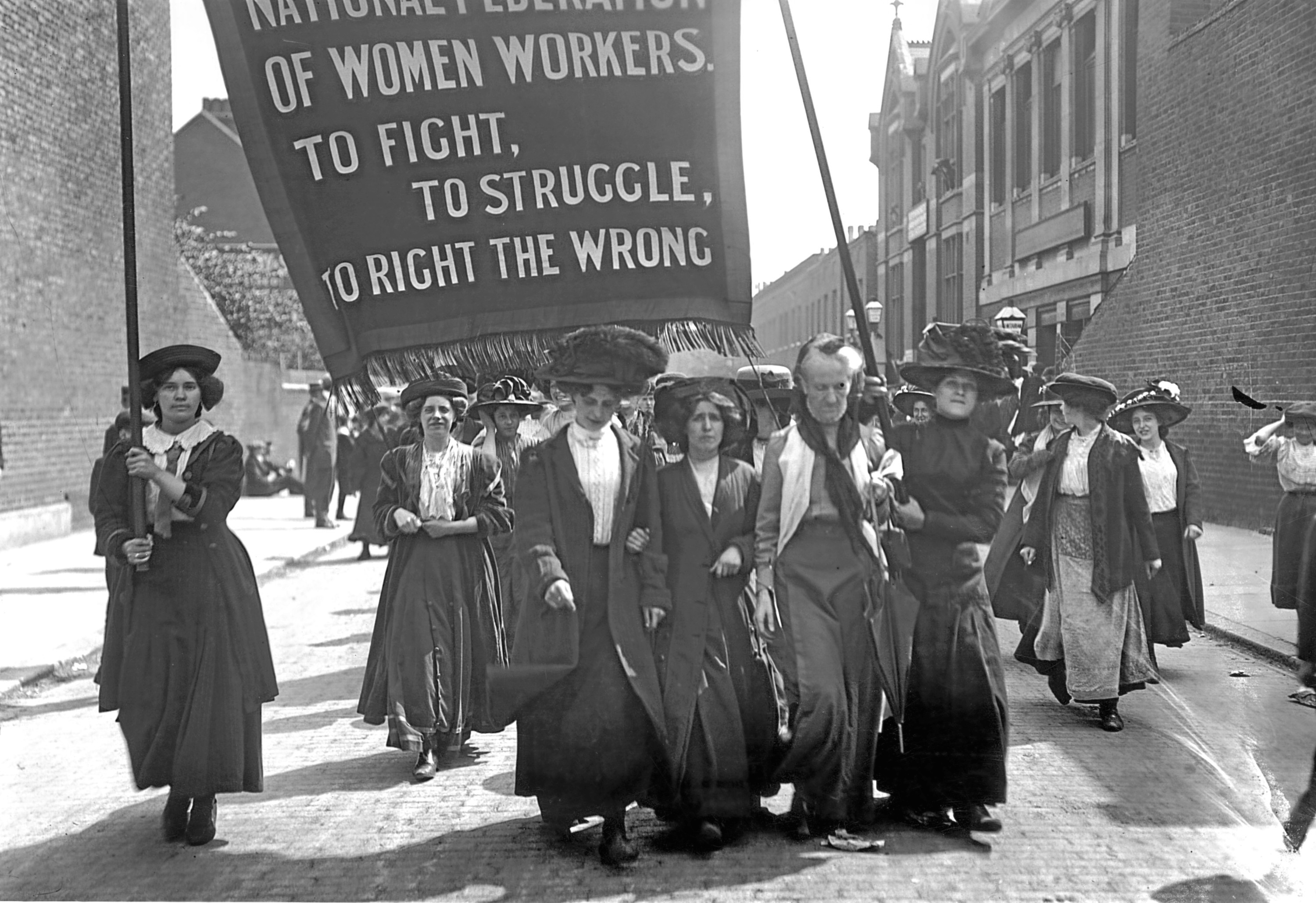 16th May 1911:  British suffragette Charlotte Despard (1844 - 1939) (wearing a white waistcoat) heads a march of the National Federation of Women Workers through Bermondsey in South London.  (Topical Press Agency/Getty Images)