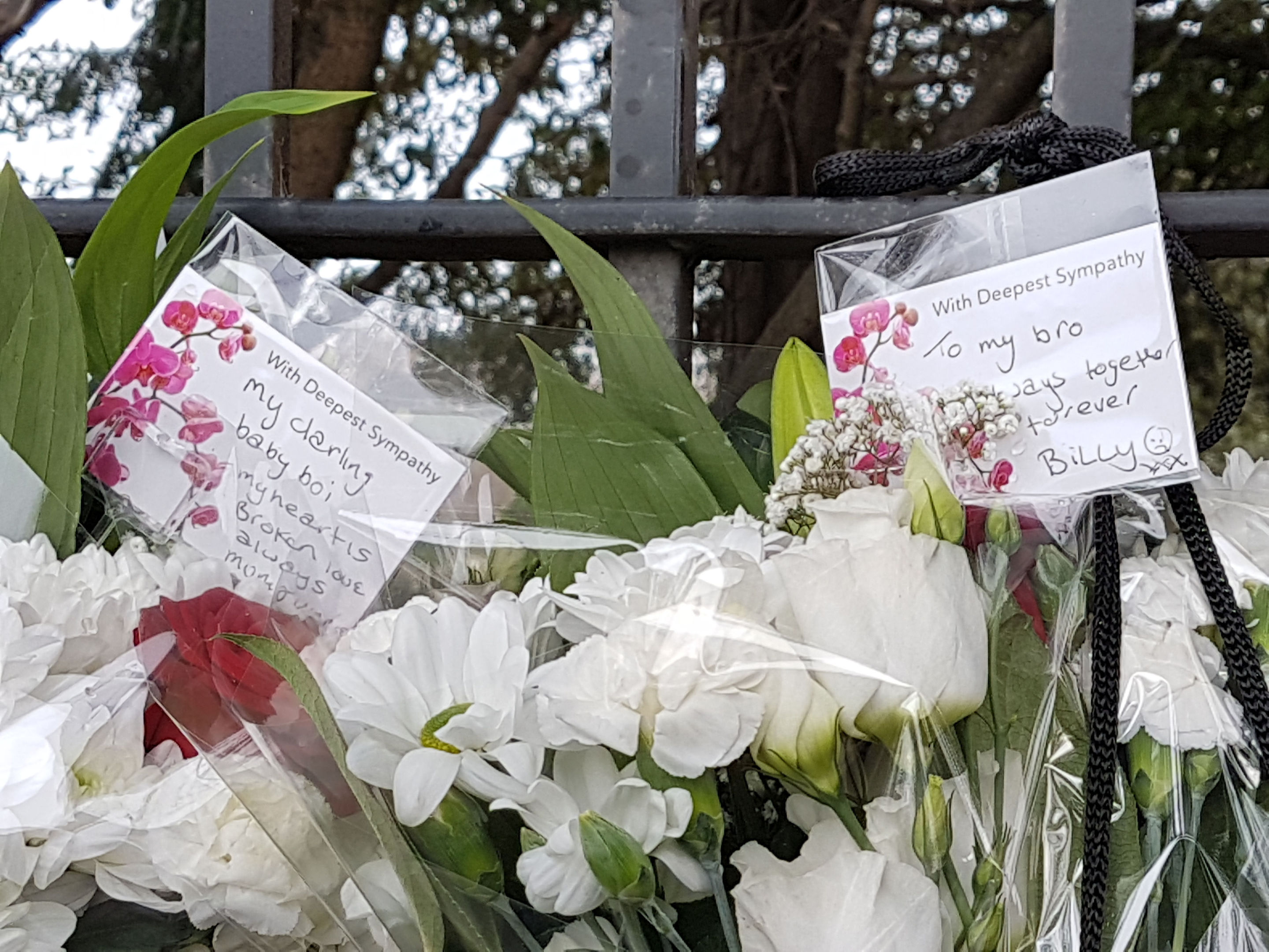 Floral tributes left near the scene in Shepiston Lane in Hayes, west London where three teenage boys have died after a car ploughed into a bus stop. (Tess De La Mare/PA Wire)