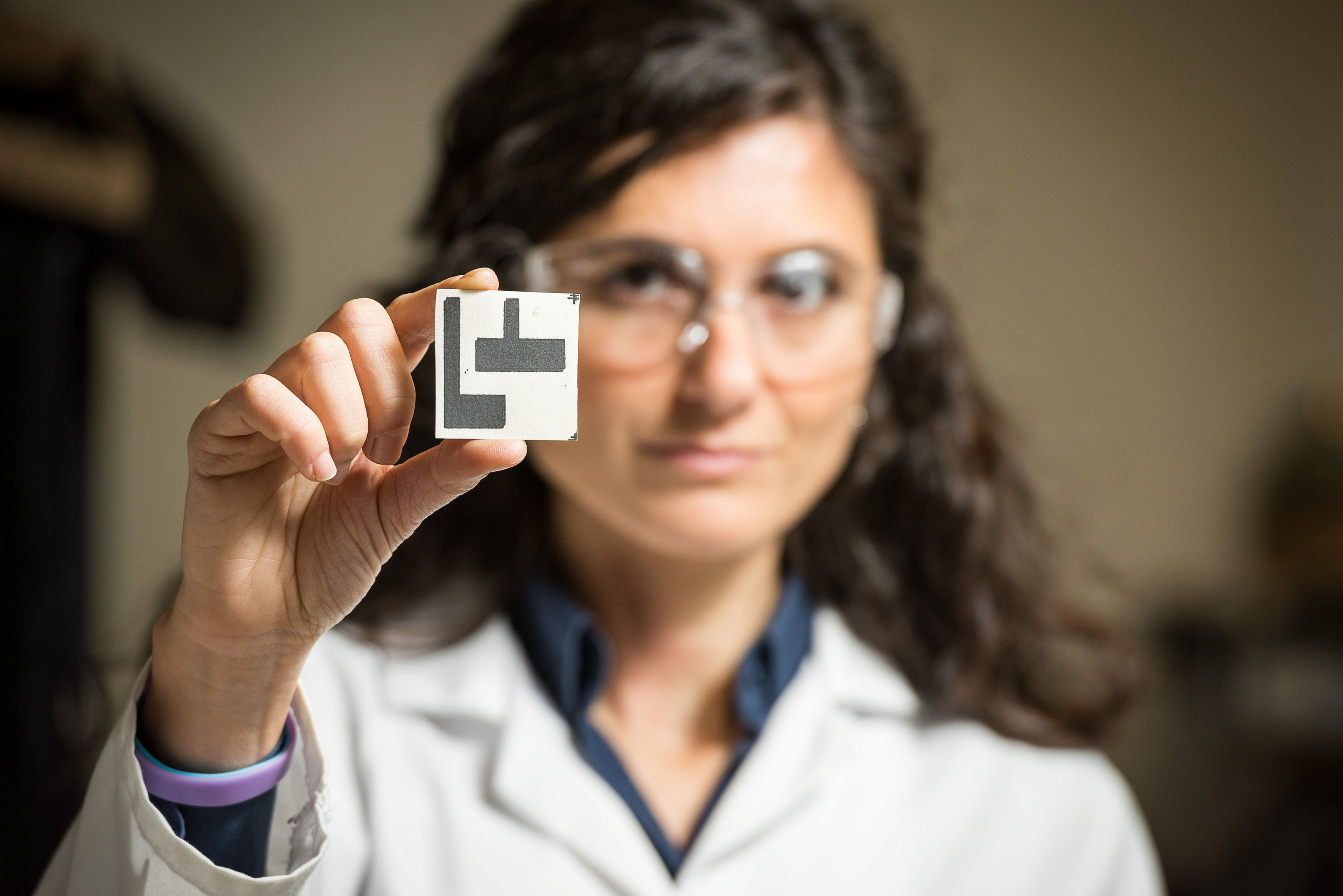 Dr Mirella Di Lorenzo with the microbial-based paper sensor that can detect toxic compounds in water (Nic Delves-Broughton/ University of Bath/PA Wire)