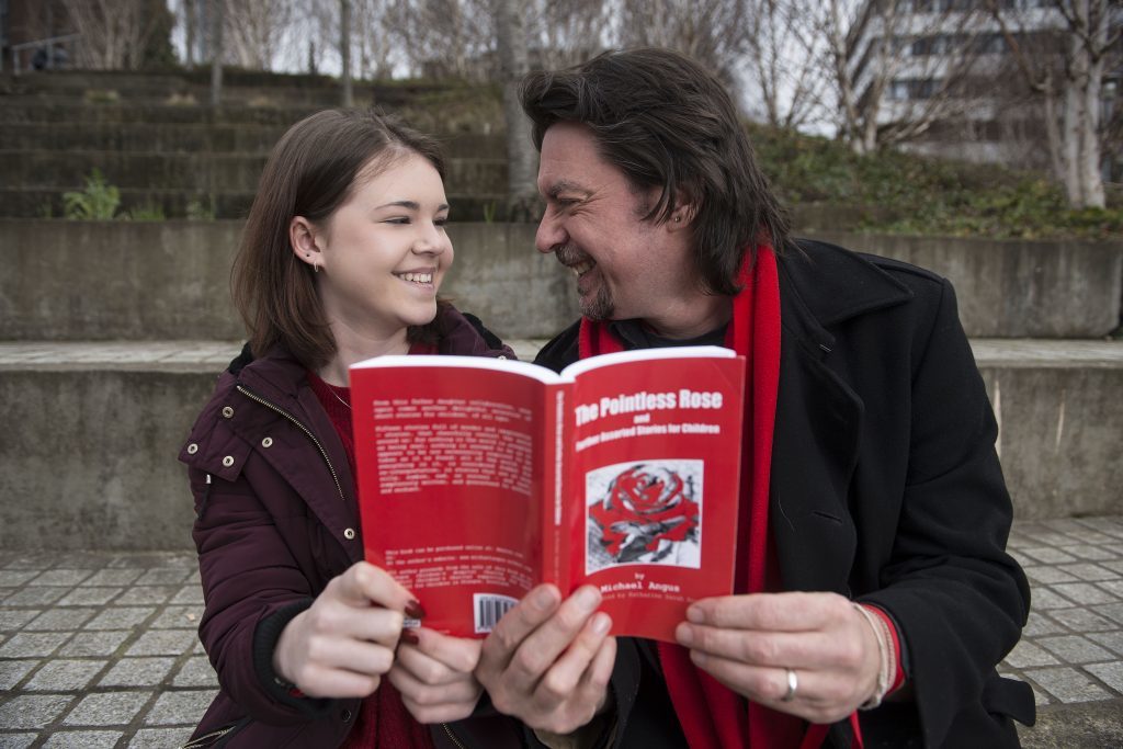 Michael Angus (53) and his daughter Katie (11) in Glasgow today (Friday) .Michael has written a book about his son Christopher who died age 6 due to to heart failure. He is launching a book called The Pointless Rose , which was illustrated by his daughter Katie ,  after promising his son that he would write a story book for him.
