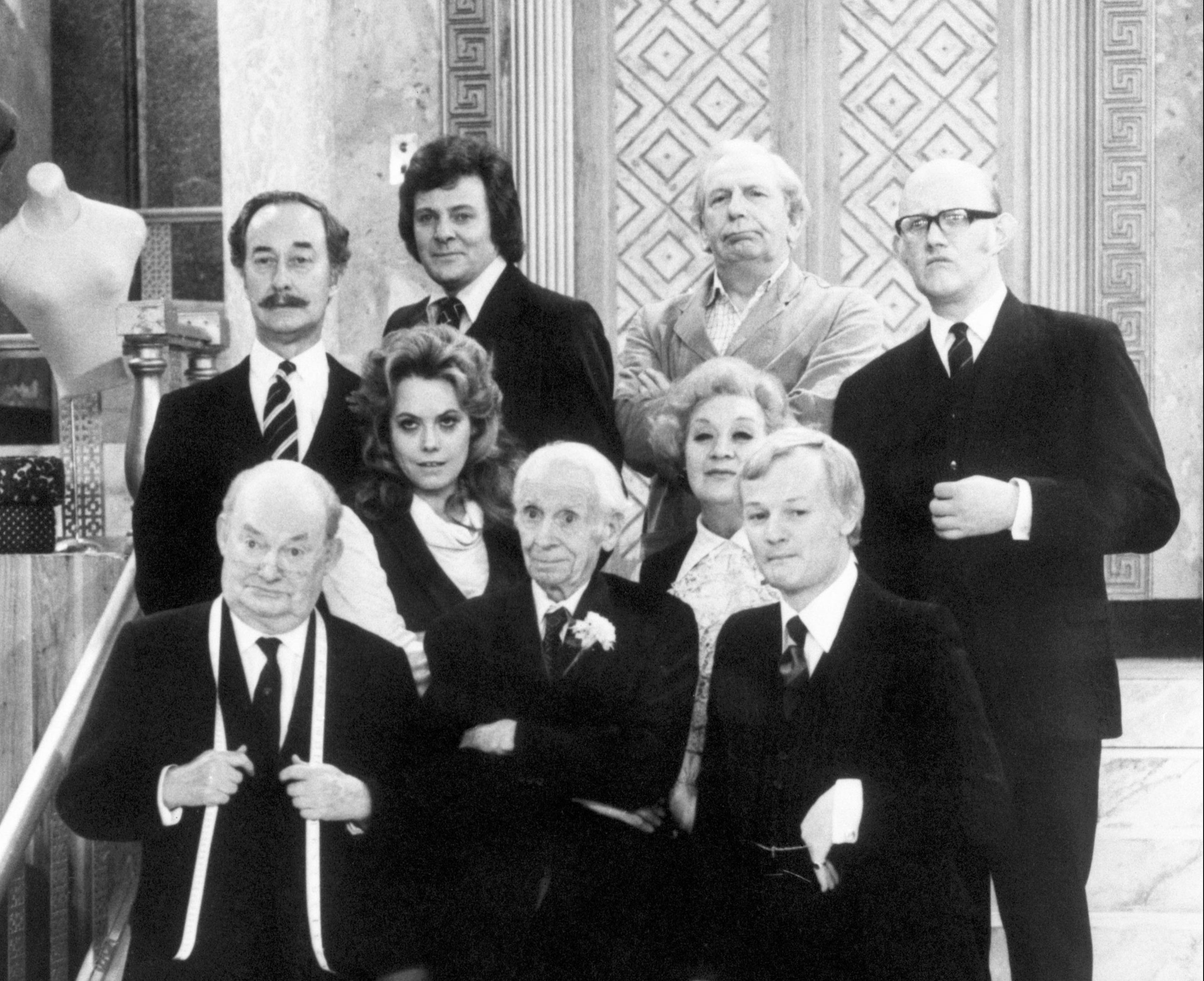Cast members on set during filming of the BBC sitcom Are You Being Served. (top l-r) Frank Thornton (Captain Stephen Peacock), Trevor Bannister (Mr. Dick/James Lucas), Arthur English (Mr. Beverley/Harry Harman) and Nicholas Smith (Mr. Cuthbert Rumbold). (middle l-r) Wendy Richard (Miss Shirley Brahms) and Mollie Sugden (Mrs. Betty Slocombe) (front l-r) Arthur Brough (Mr. Ernest Grainger), Harold Bennett (Young Mr. Grace) and John Inman (Mr. Wilberforce Claybourne Humphries) (PA)