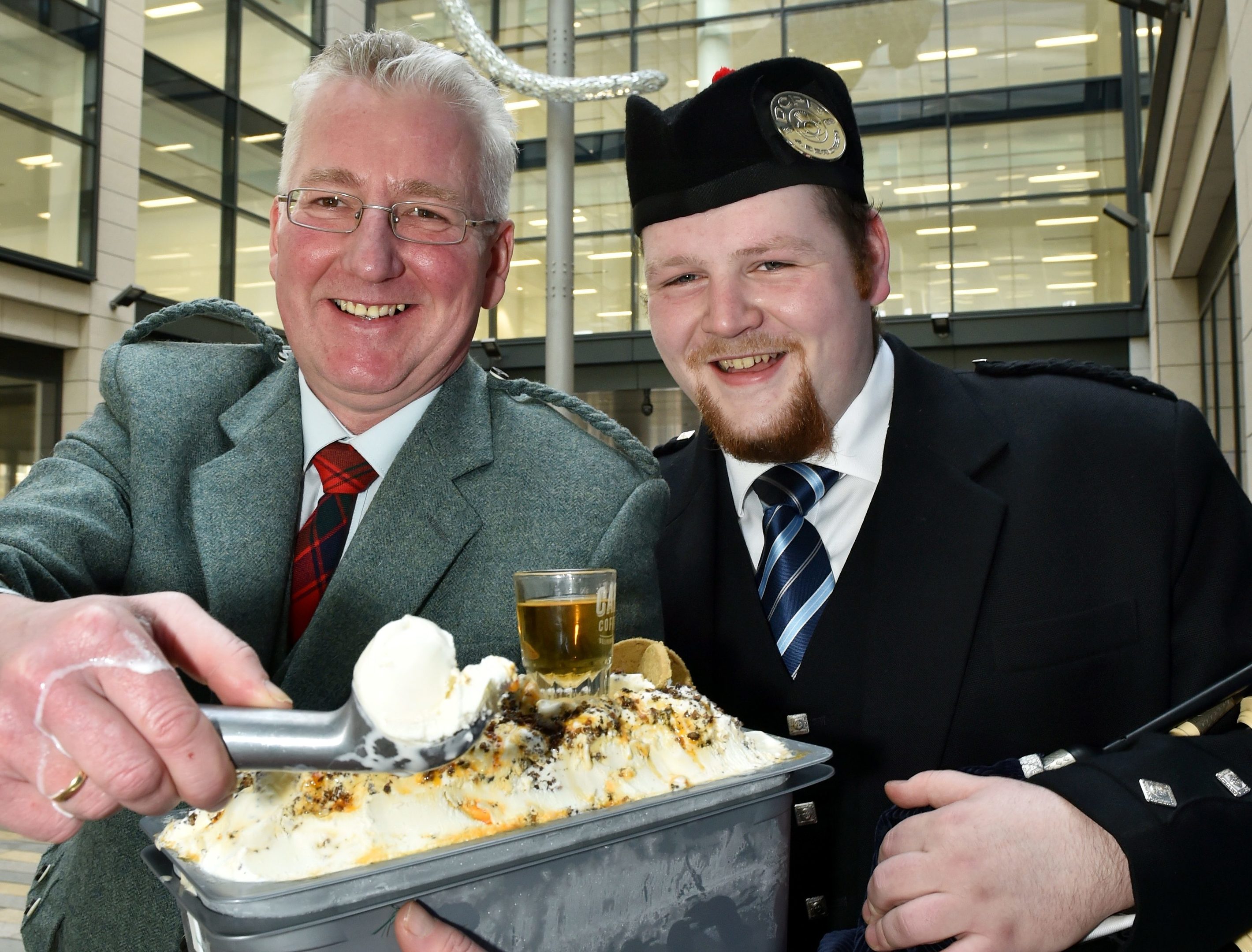 A 'Napoli' of Haggis Ice Cream was piped by Robert Reid, a member of the Deeside Caledona Pipe Band. The Haggis and Marmalade Ice Cream is tasted by Mackie's John Reid. (Colin Rennie)