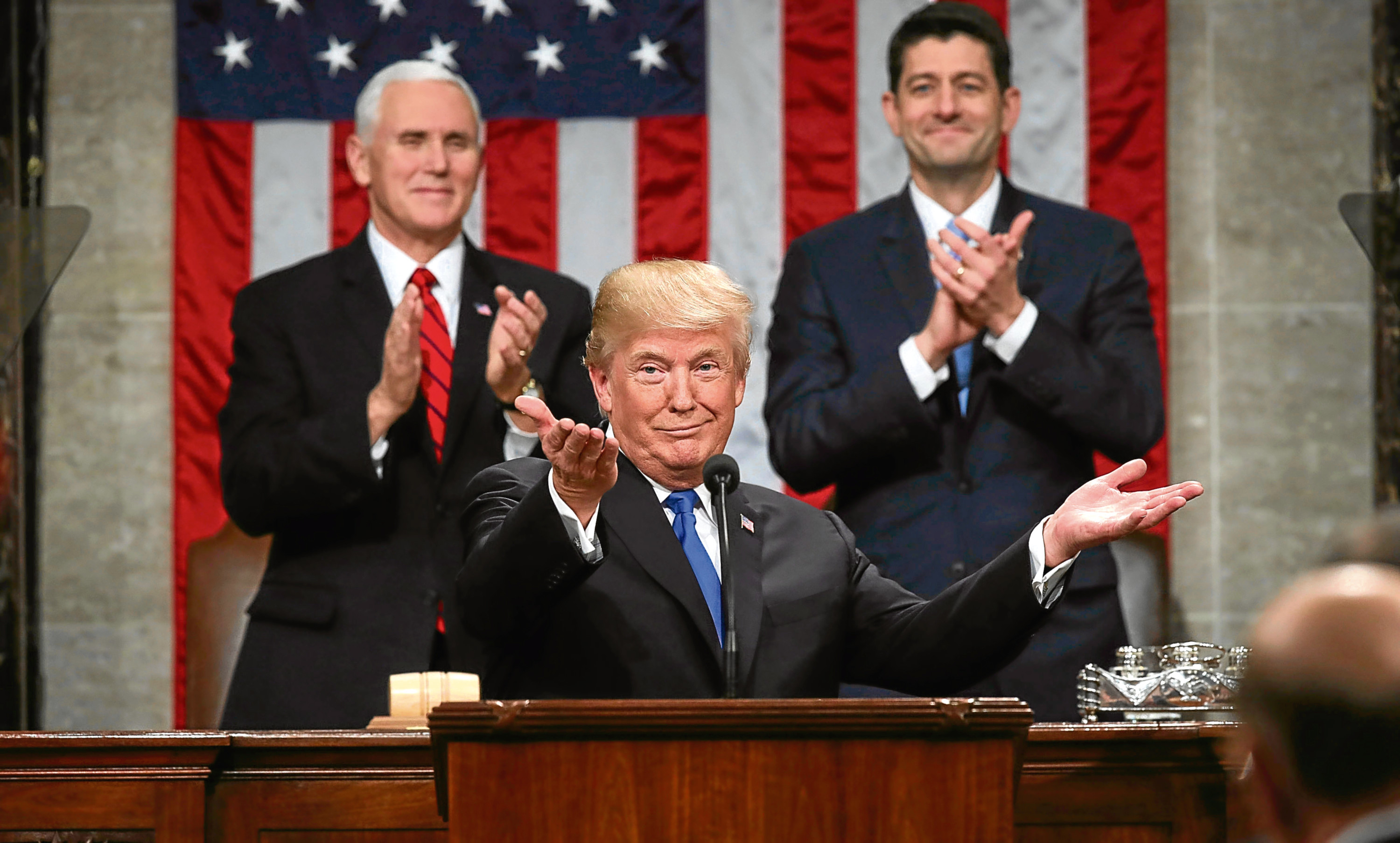 President Donald Trump gestures as delivers his first State of the Union address  (Win McNamee/Pool via AP)