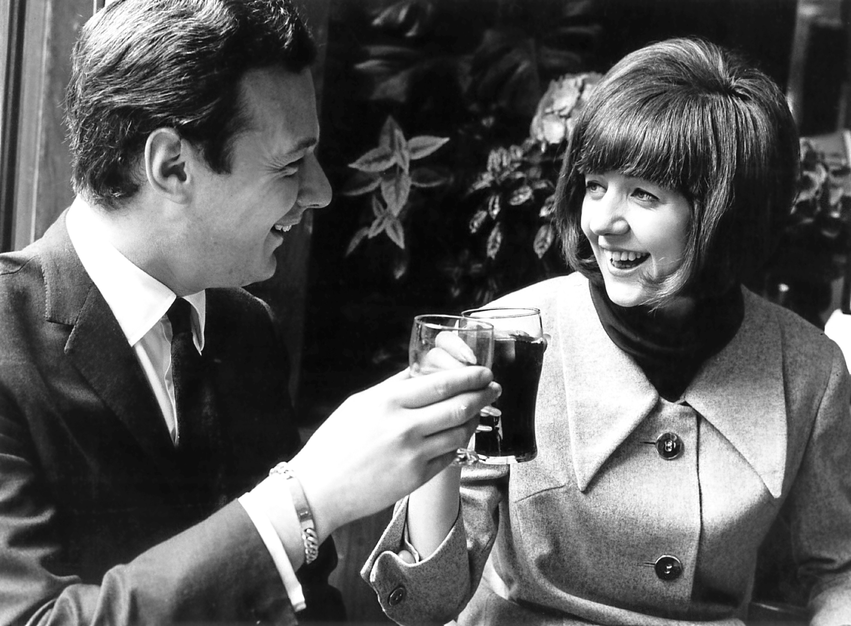 Cilla Black with her manager Brian Epstein, 1964.  (Evening Standard/Hulton Archive/Getty Images)
