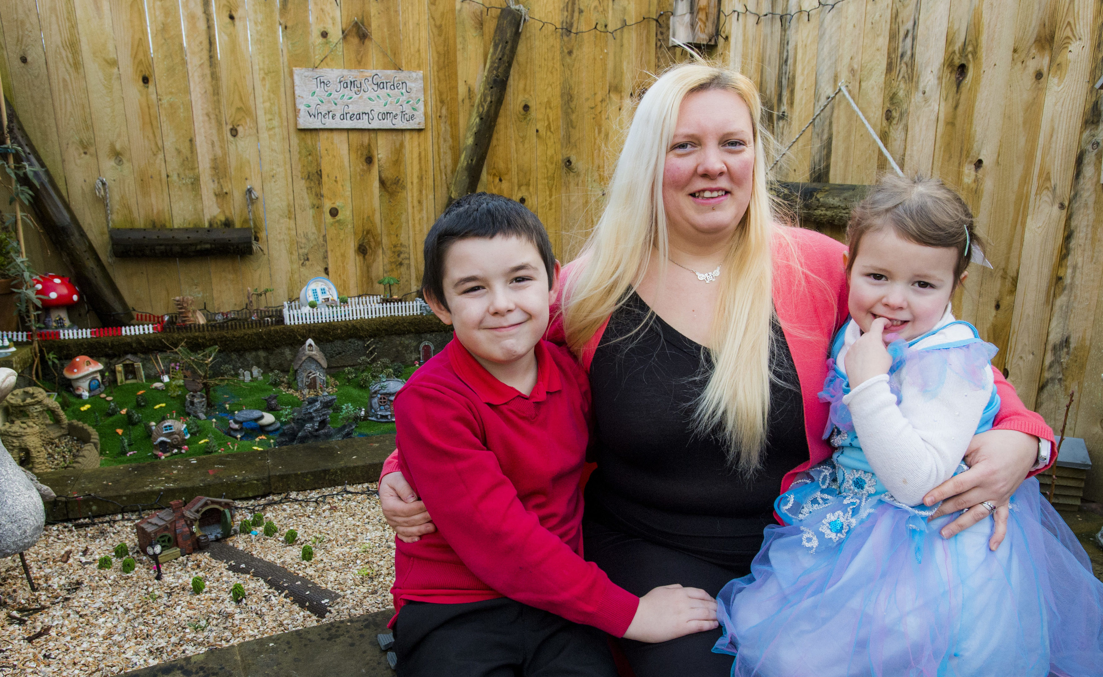 Lori Grant with Mark and Lily with their garden ornaments (Alan Peebles)