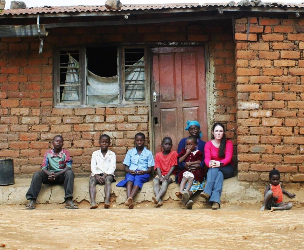 Sandi Thom accompanied by Lucy Maluwa, and some of her grandchildren, in Malawi, southern Africa. (Edlon Chagara/Oxfam/PA Wire)