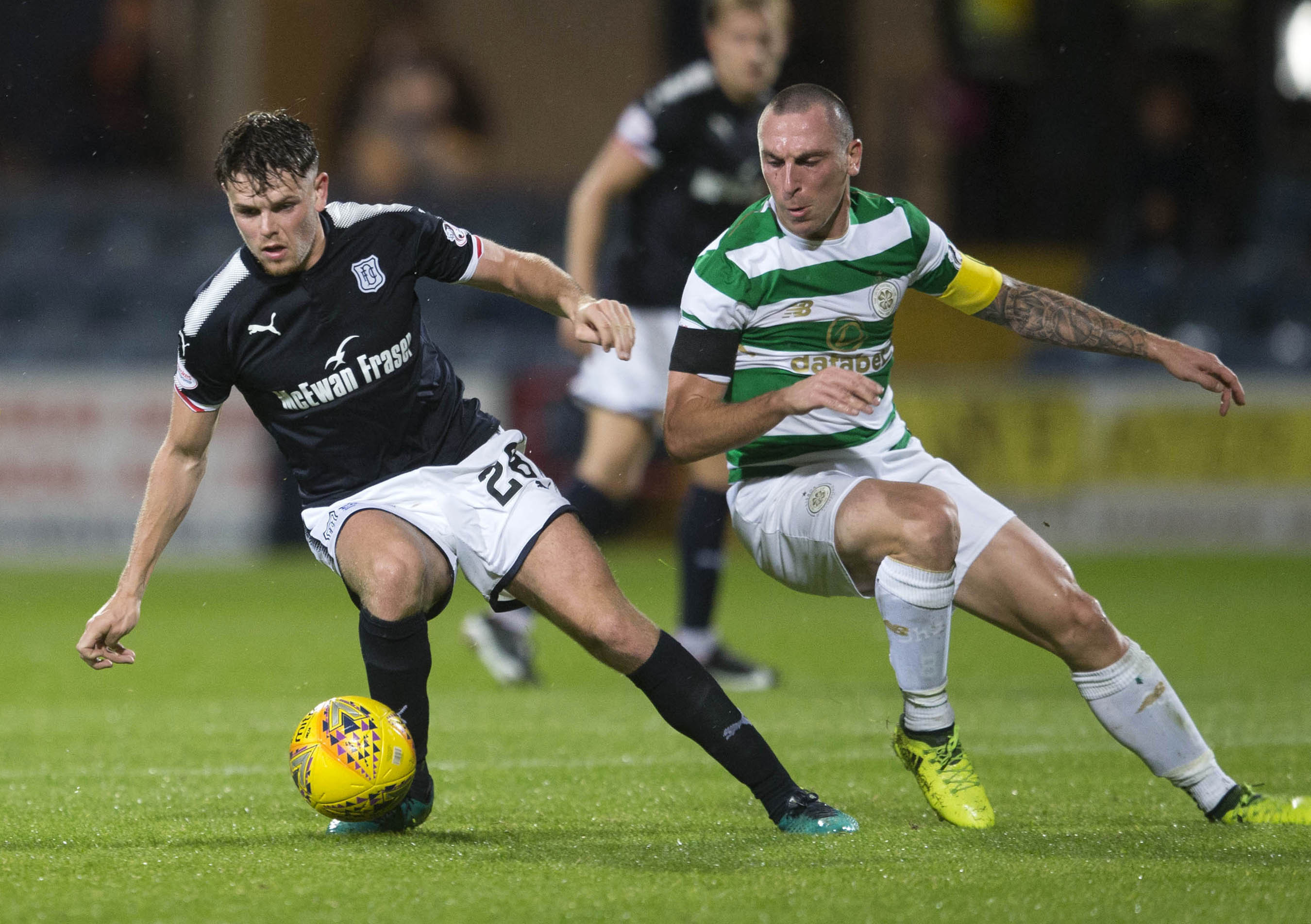 Dundee's Lewis Spence (left) and Celtic's Scott Brown (right) (Jeff Holmes/PA Wire)