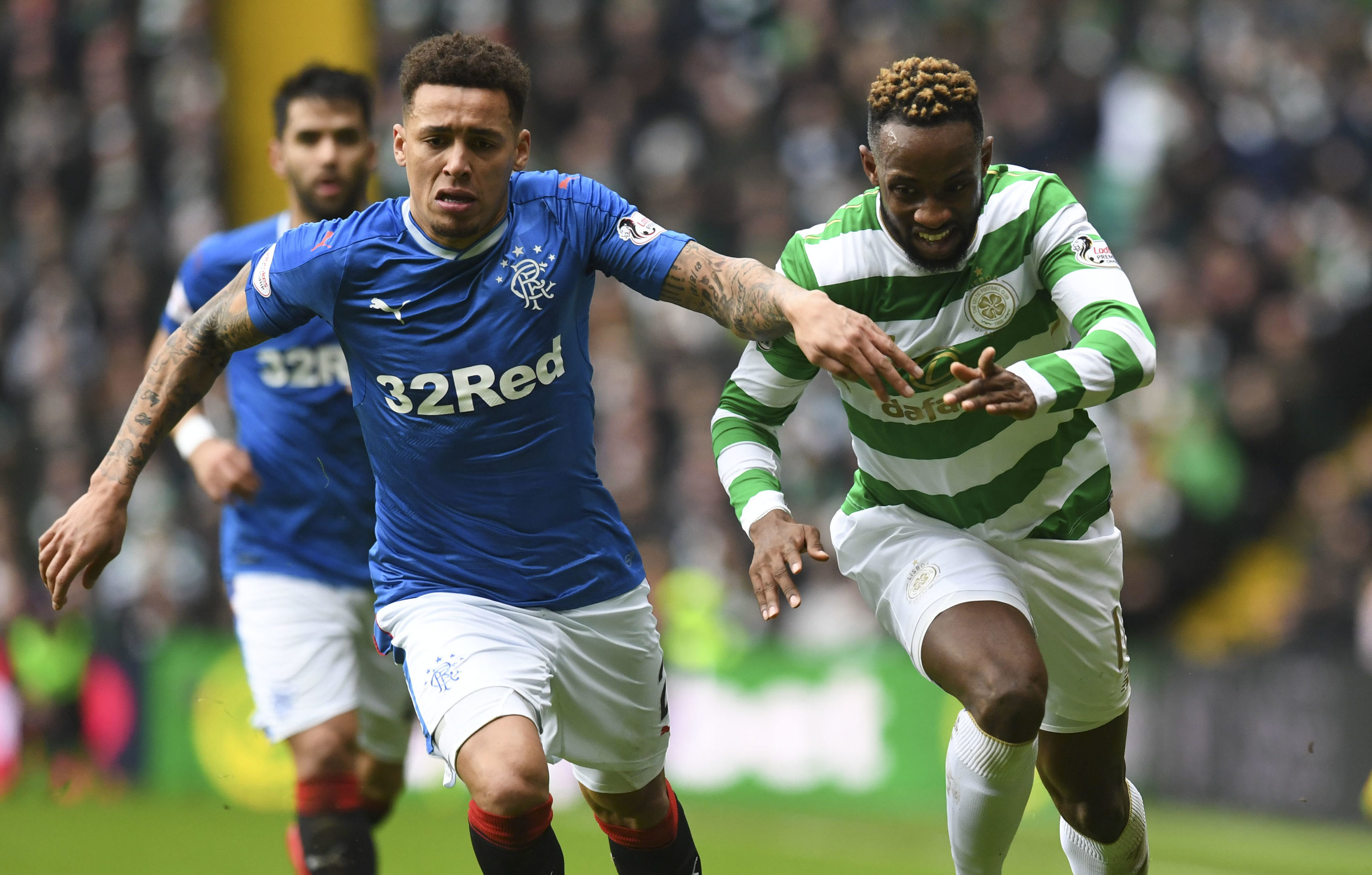 Rangers' James Tavernier (left) with Moussa Dembele in December's derby (SNS Group)
