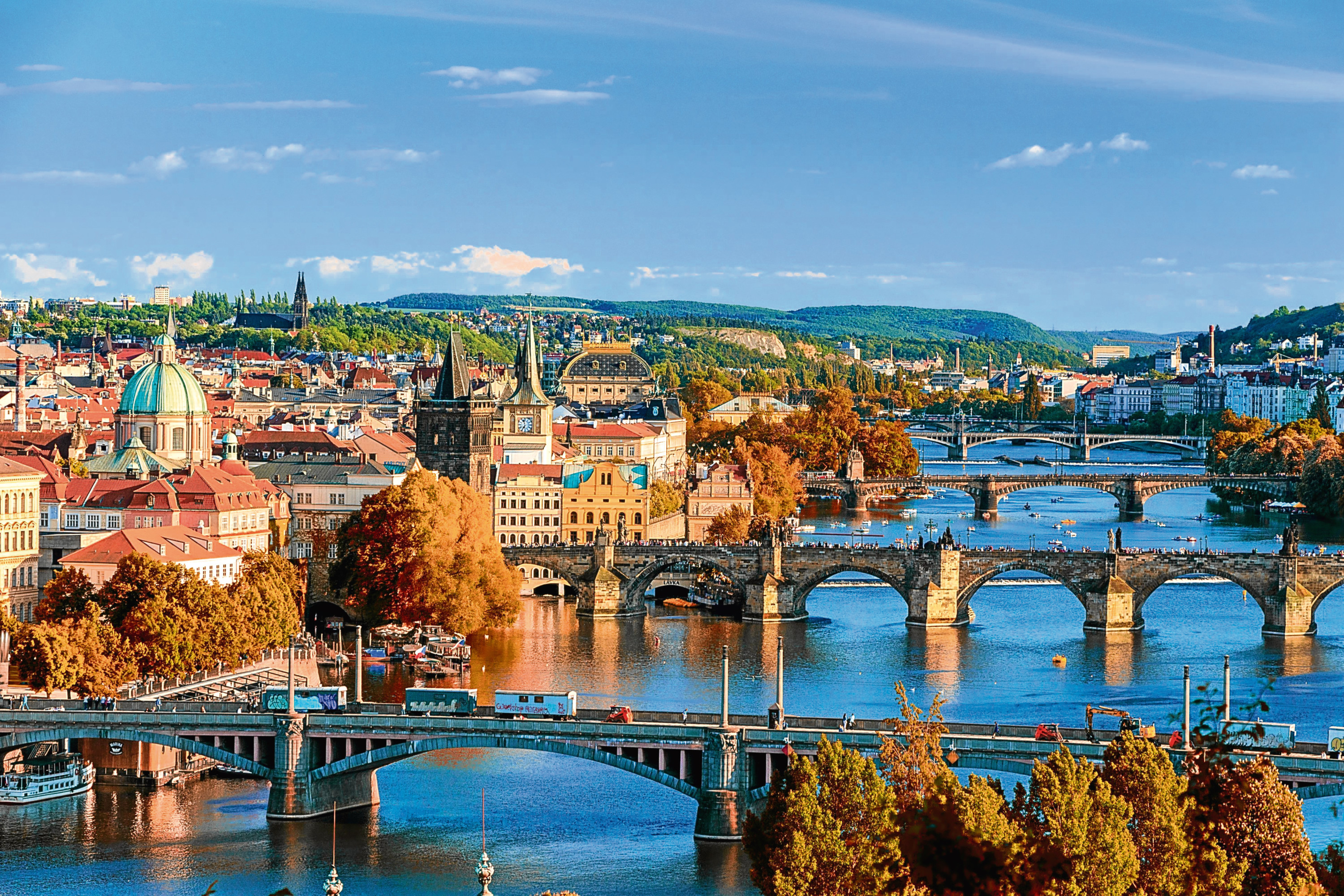 View of the Vltava River and Charle bridge with red foliage, Prague, Czech Republic (Getty Images)