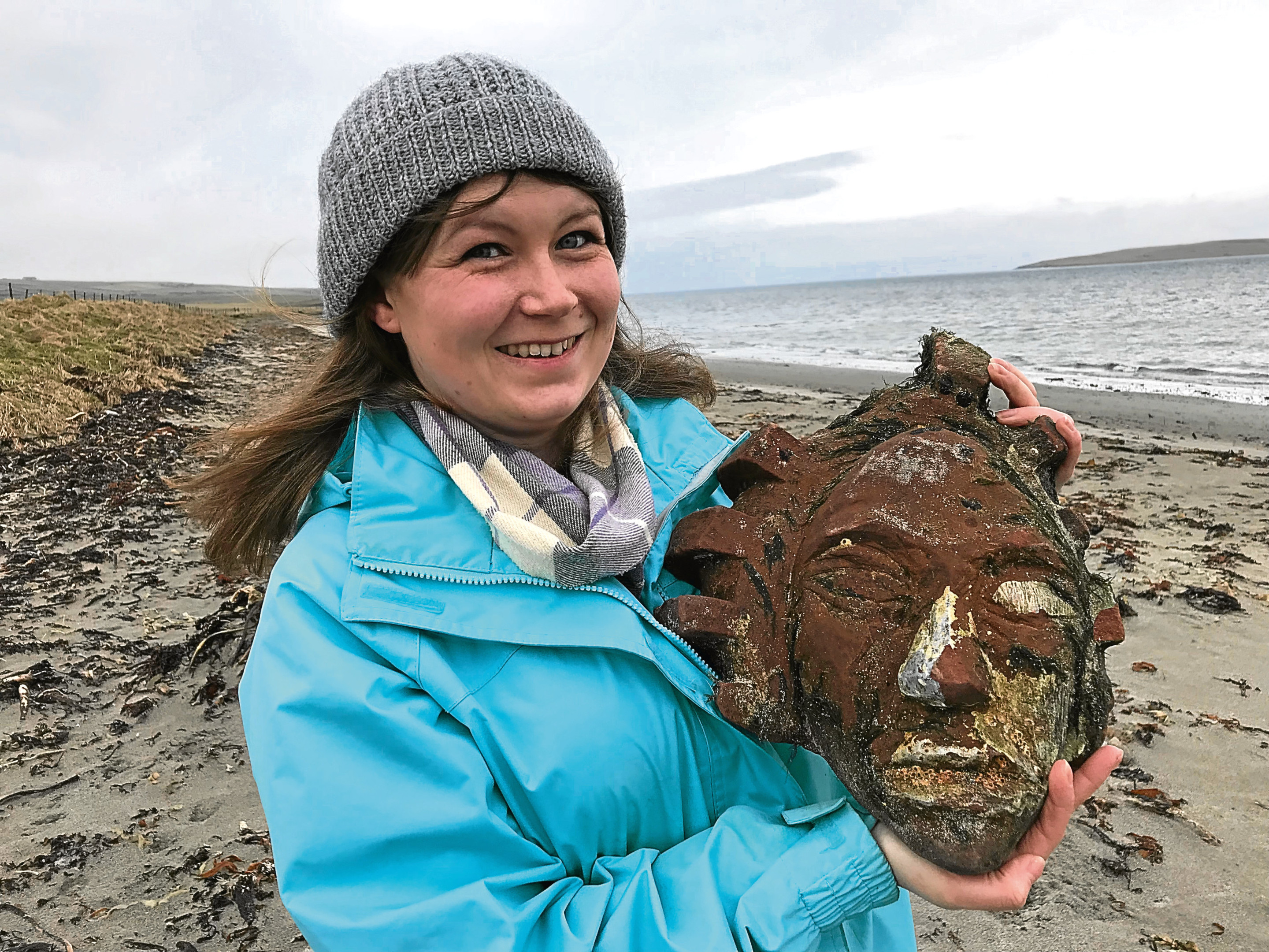 Kerry Leitch who found a sandstone head on the beach in Orkney. (Orcadian)