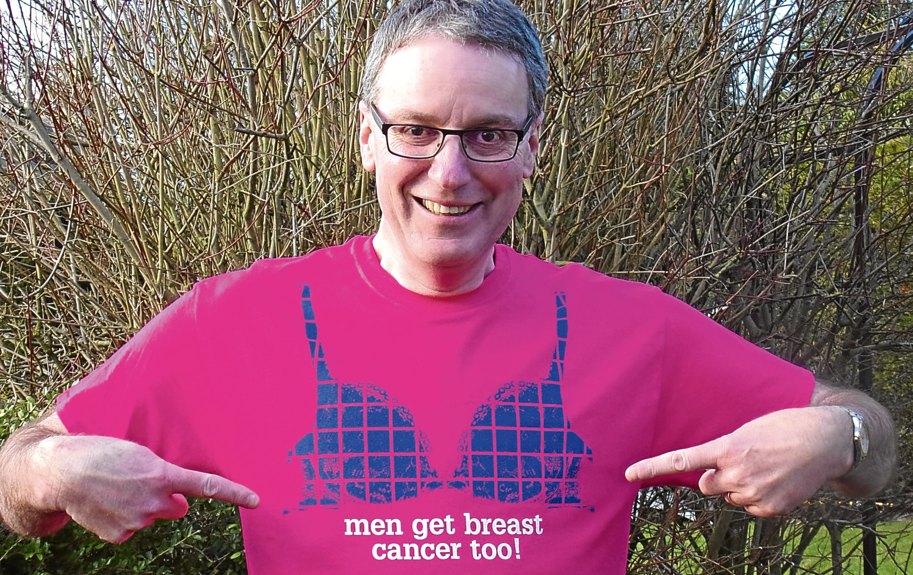 Breast cancer survivor Giles Cooper is delighted with his new T-shirt