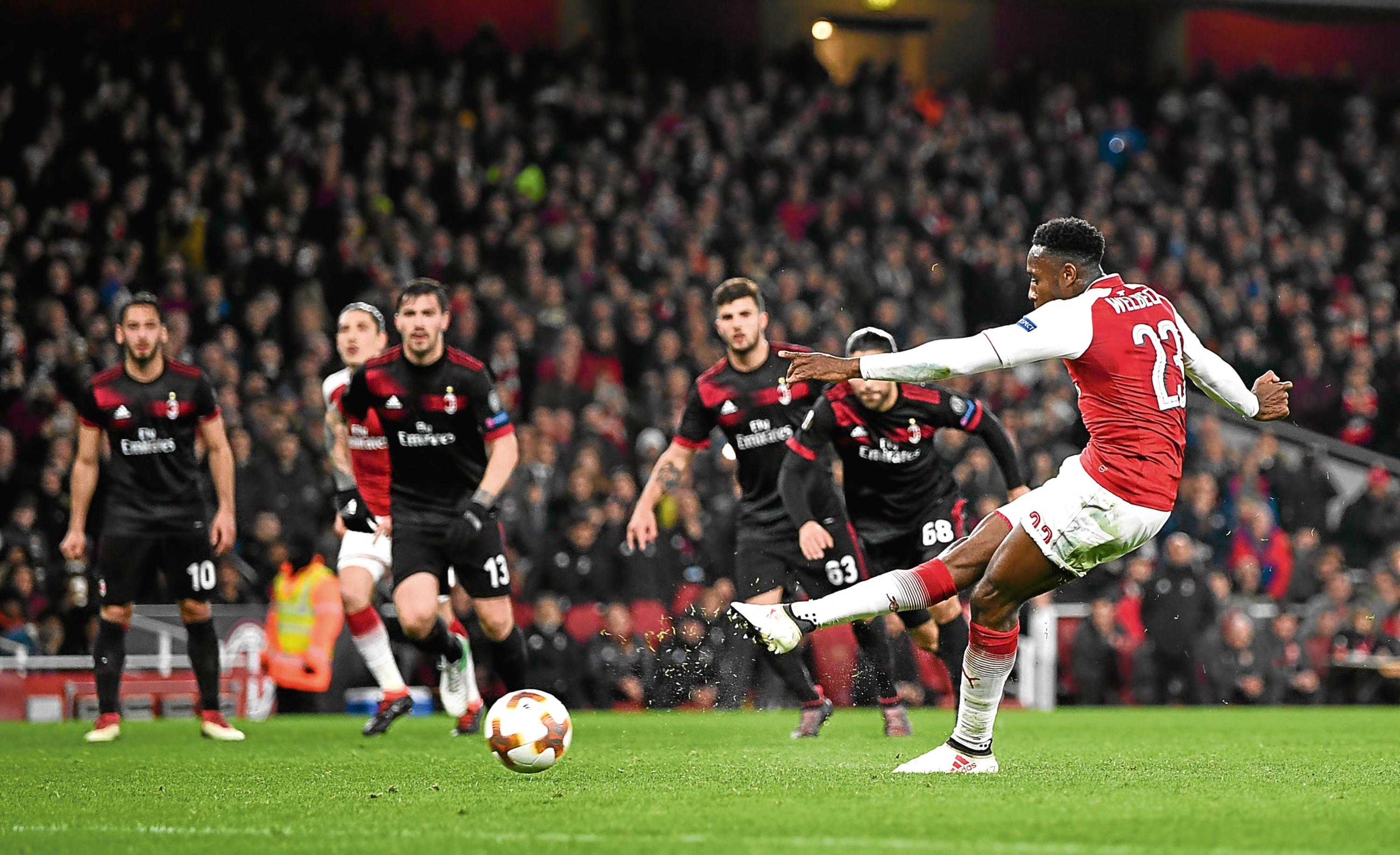 Danny Welbeck scores from the spot against AC Milan last month (Shaun Botterill / Getty Images)