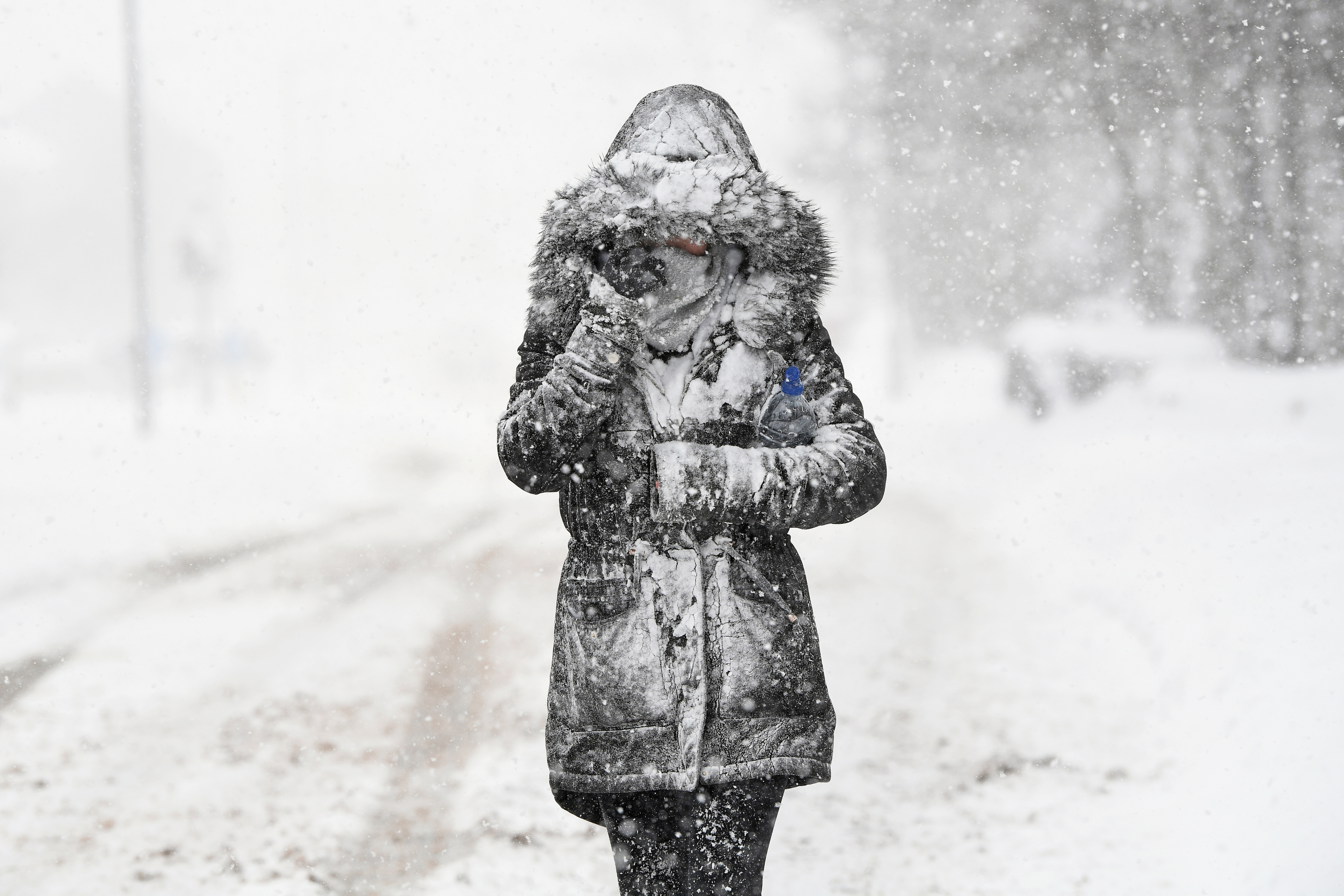 A woman makes her way through the snow on March 1, 2018 in Balloch, Scotland. (Jeff J Mitchell/Getty Images)