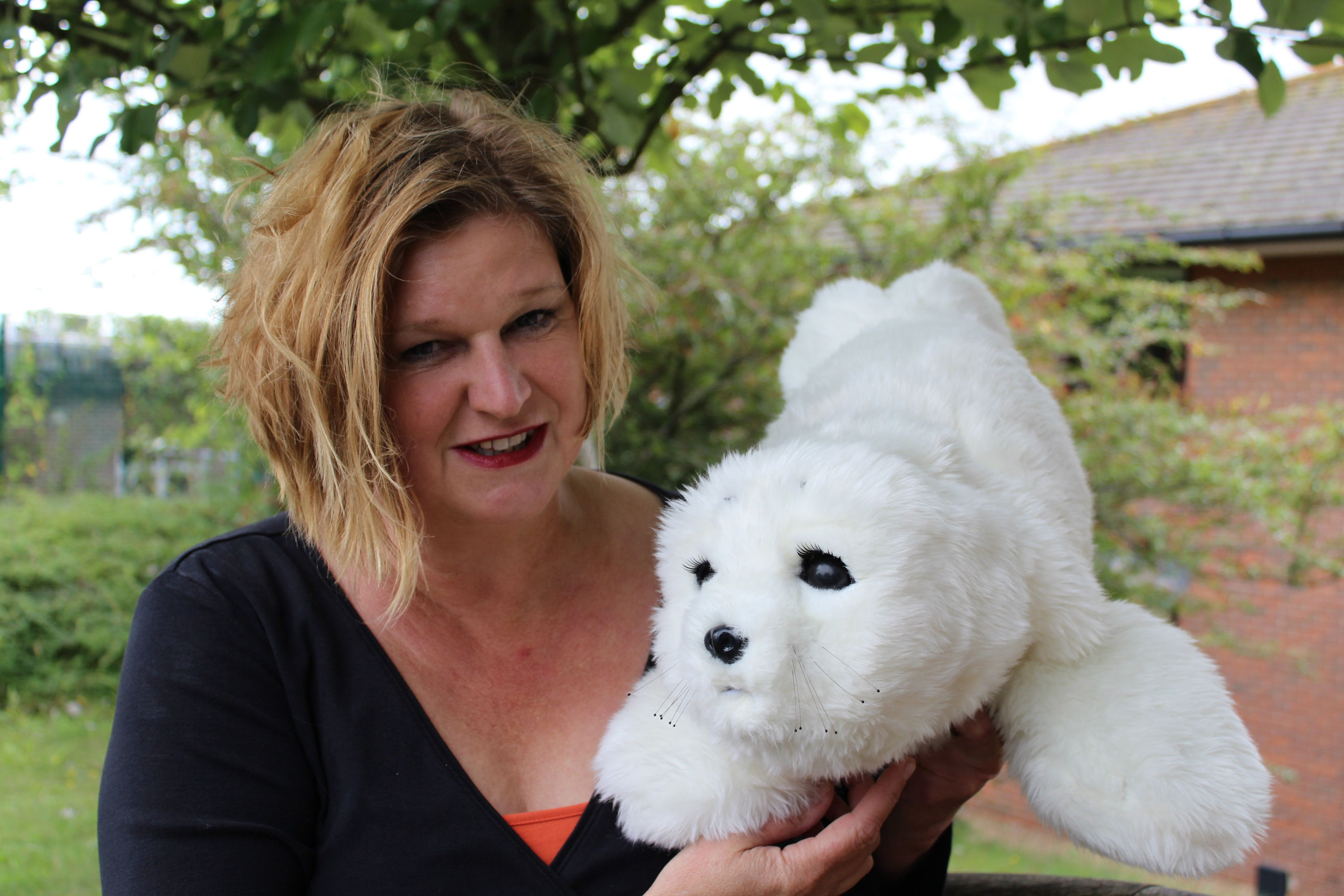 Dr Penny Dodds and a robotic seal. (University of Brighton/PA Wire)