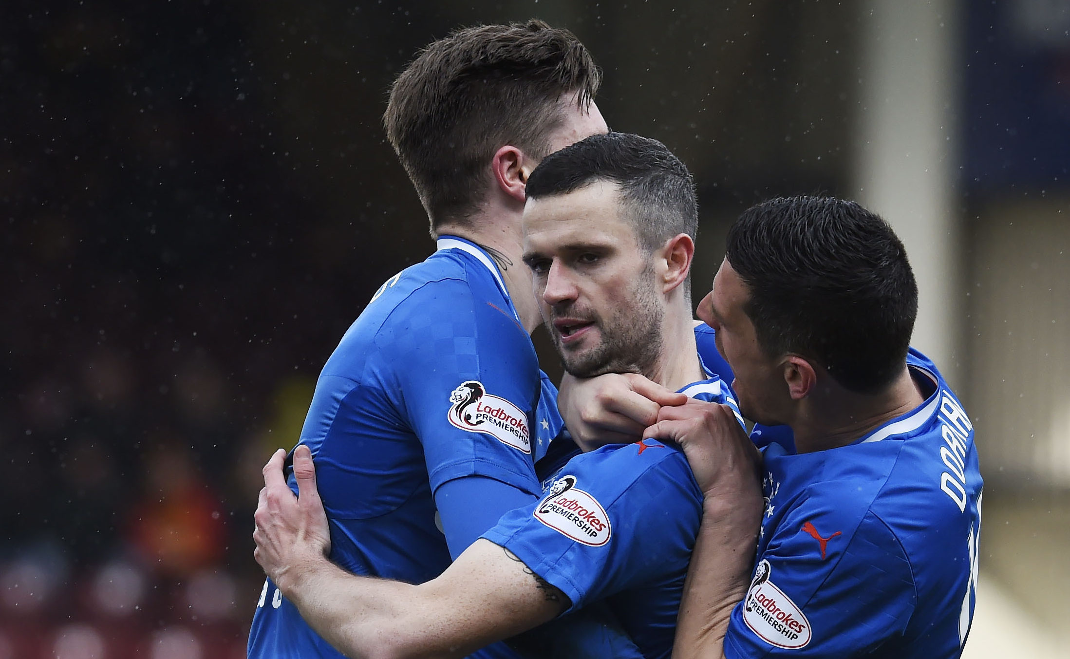 Rangers Jamie Murphy (centre) is congratulated by team-mates Josh Windass and Graham Dorrans after he scored the equalising goal (Ian Rutherford/PA Wire)