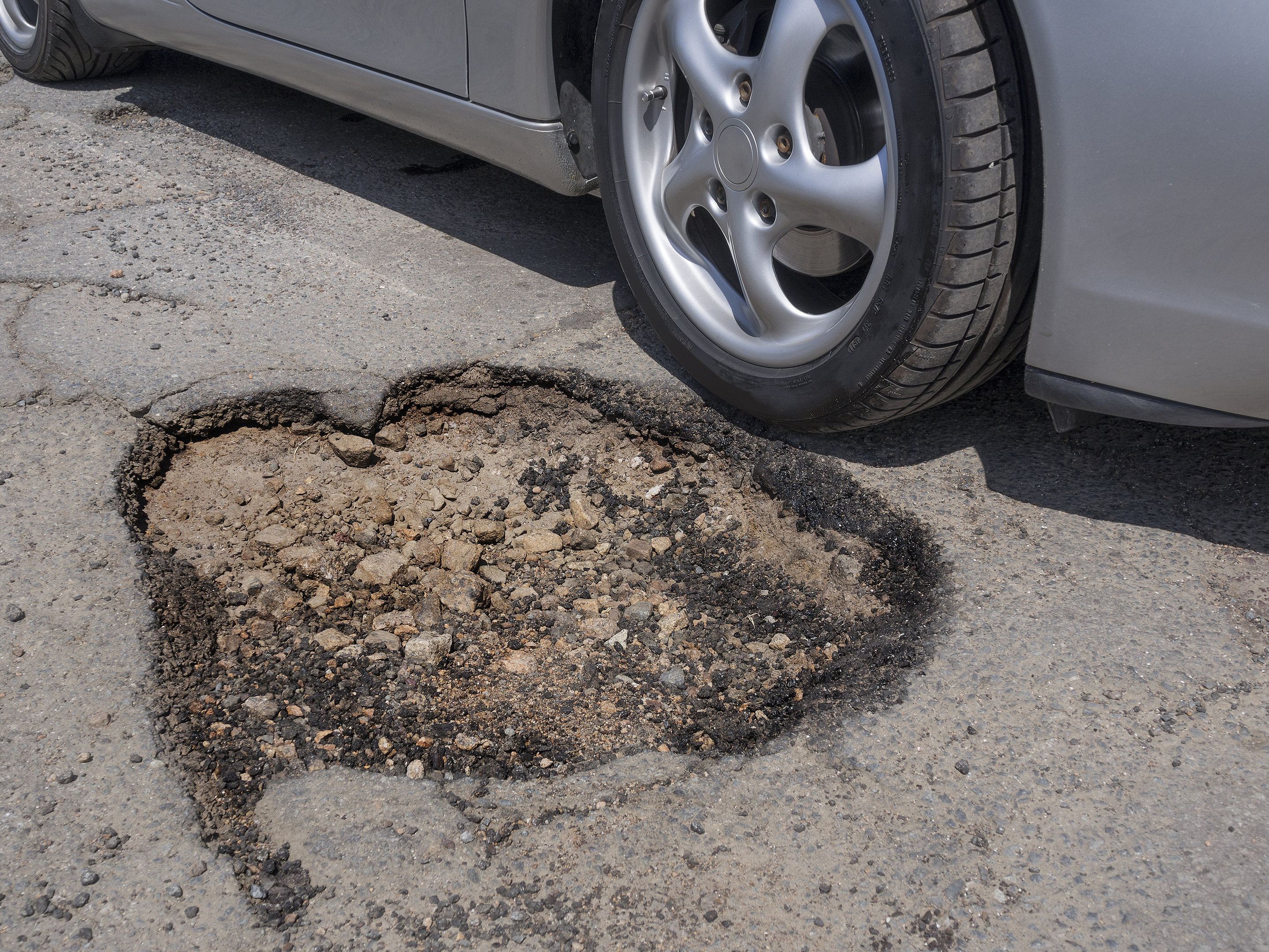 The average repair from pothole damage costs each affected Scottish driver £105.90 (Getty Images/iStock)