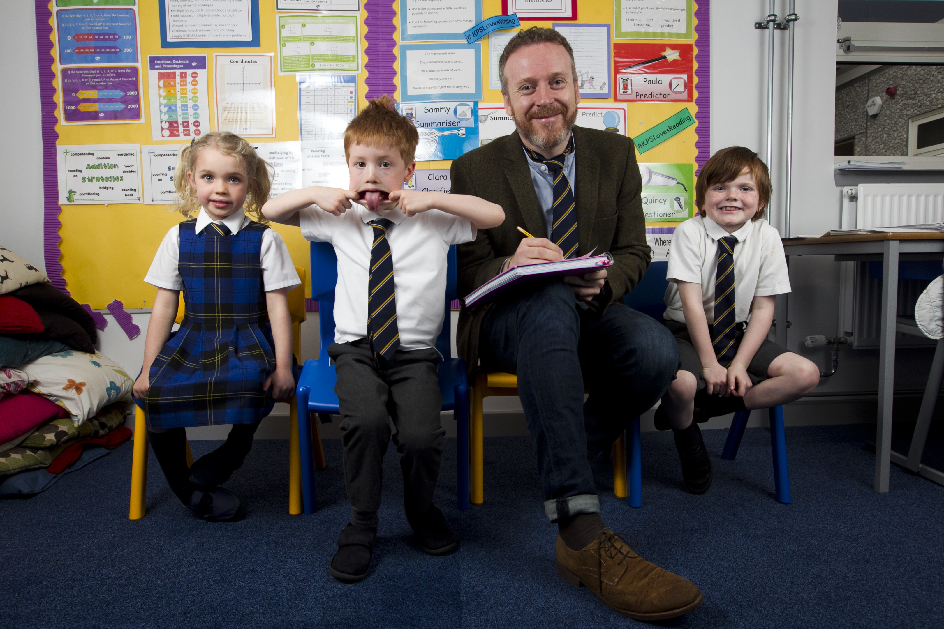 Writer Paul English meets, l-r, Anna Donaldson, Rory Bothwick, and David Wright as he visits his old primary school last week (Andrew Cawley / DC Thomson)