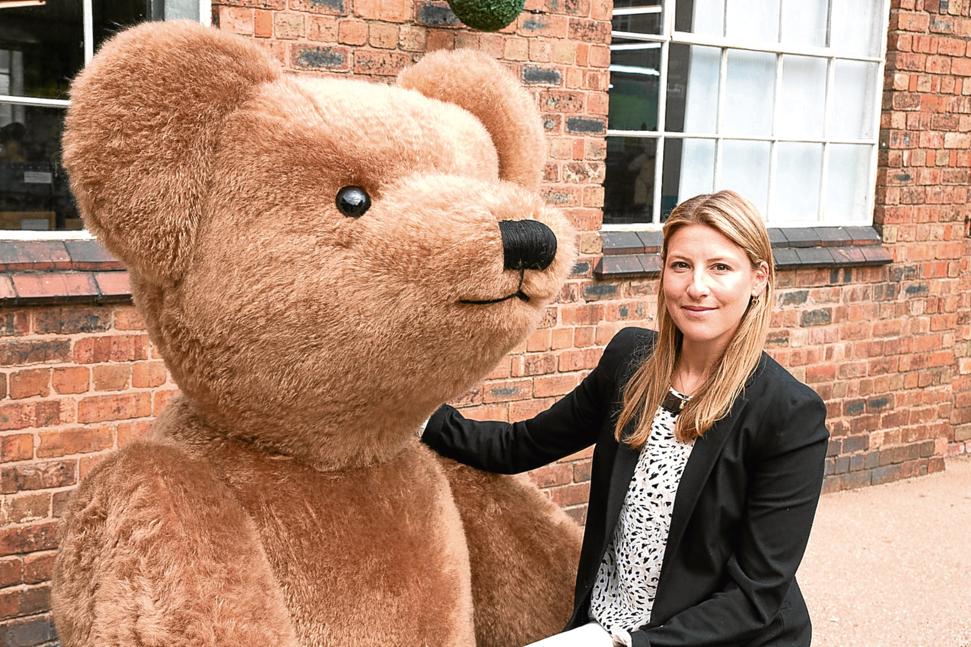 Sarah Holmes with Giant Merrythought Bear