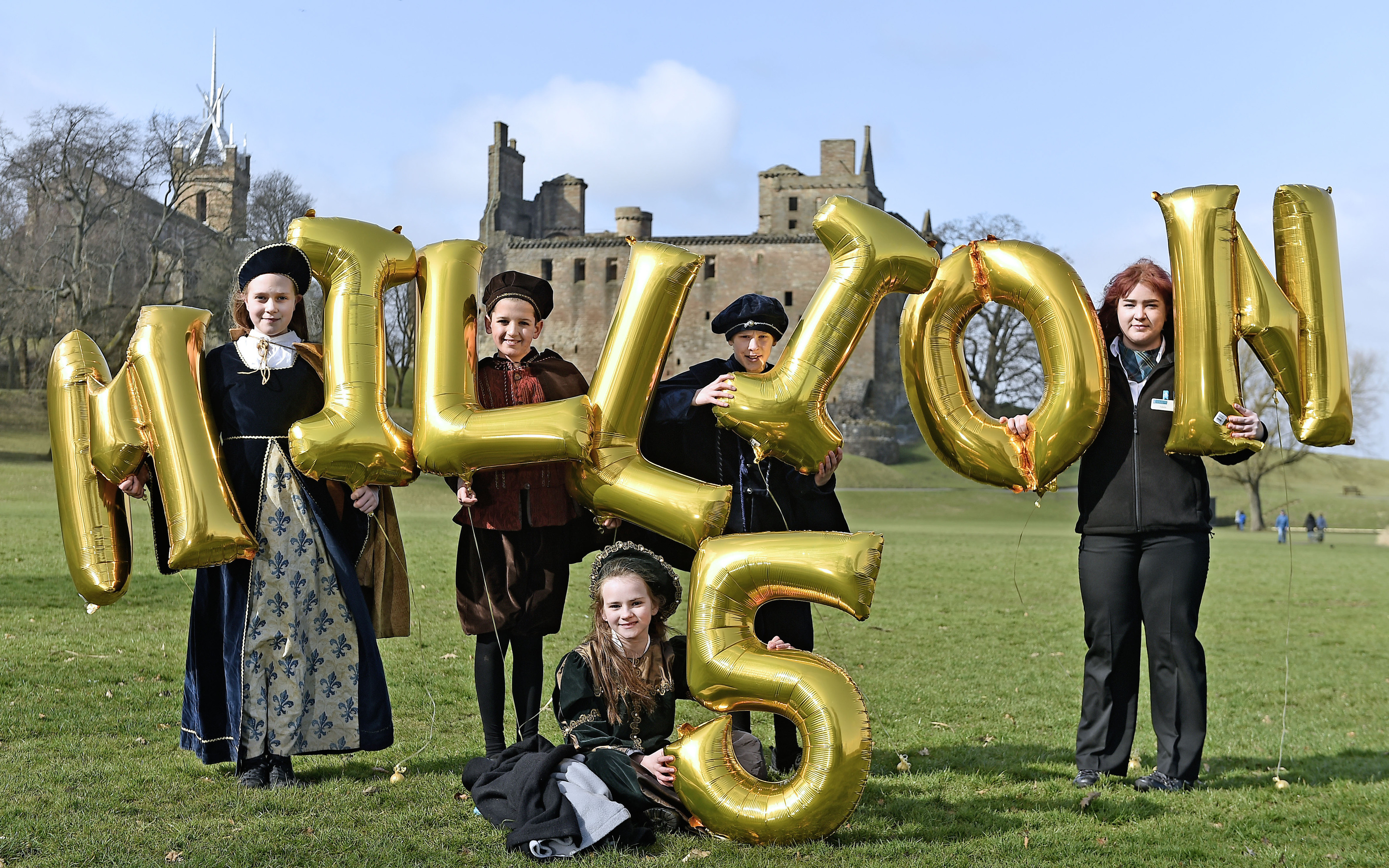 Junior Tour Guides ( L-R) Orla Mayling , Finlay Turner, Reuben Kennedy and Ellie McDonald (front) help Historic Environment Scotland (HES) celebrate a record-breaking year at Linlithgow Palace with local staff member Isabella Ogg (Neil Hanna Photography)
