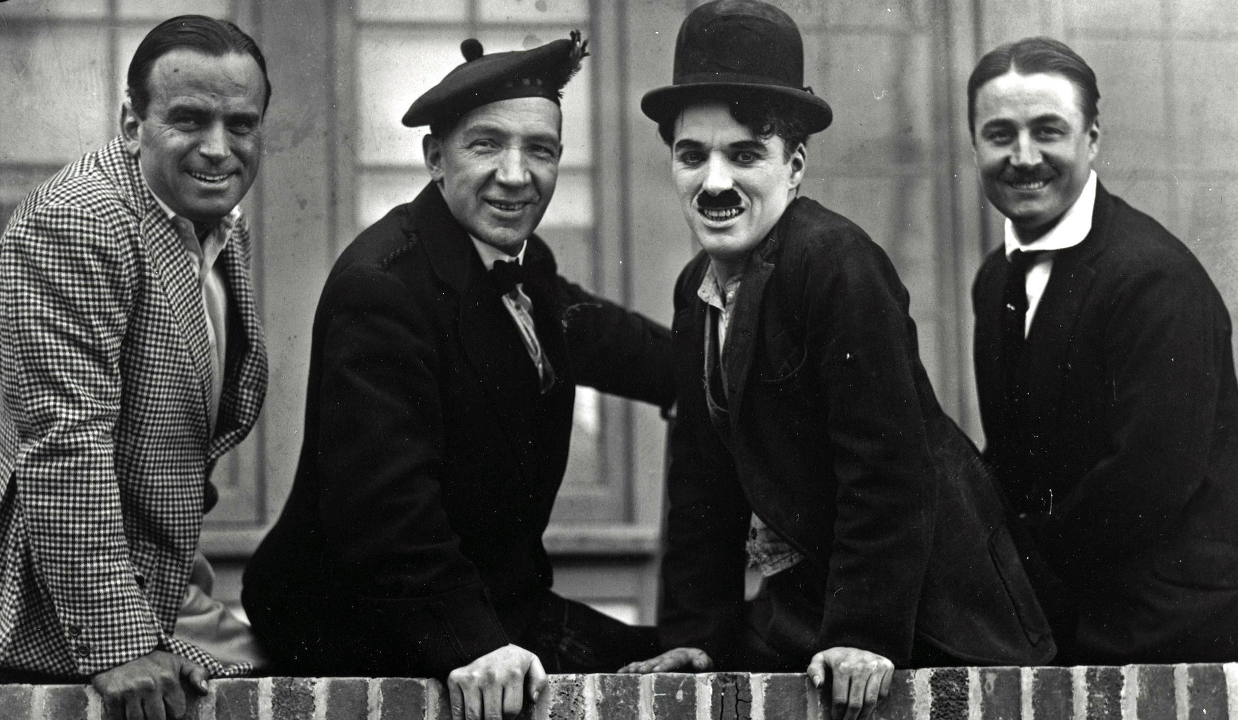 Sir Harry Lauder (second right) with Sir Charlie Chaplin (second left), as a rare screening of the moment they met on film is to be shown at a new comedy film festival (Roy Export Company/PA Wire)