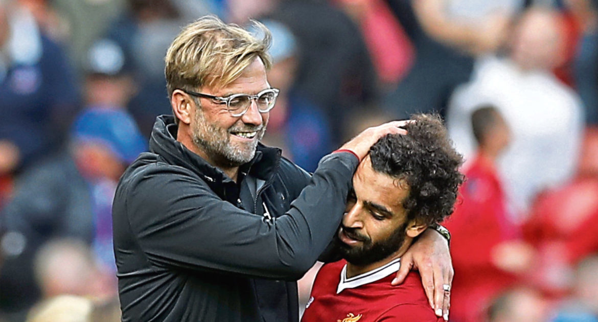 Liverpool manager Jurgen Klopp celebrates with Mohamed Salah (Martin Rickett/PA Wire)